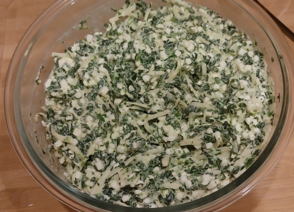 ADDING SPINACH TO THE CHEESE