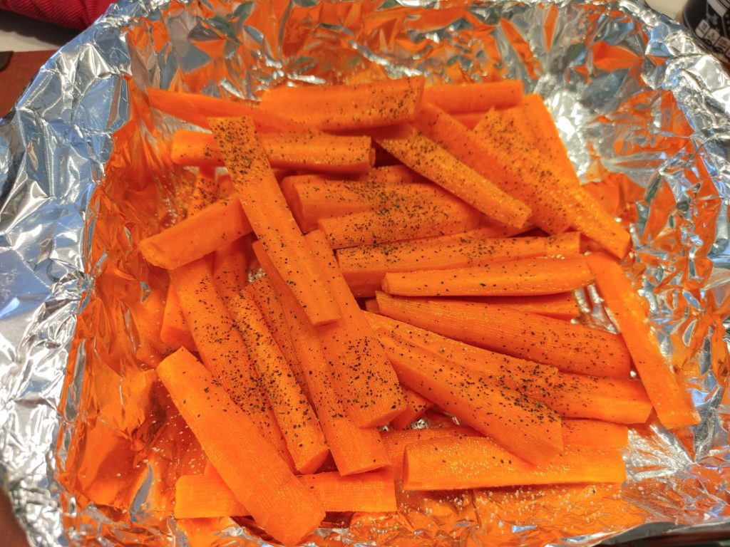 cleaned and seasoned with salt  and pepper carrots