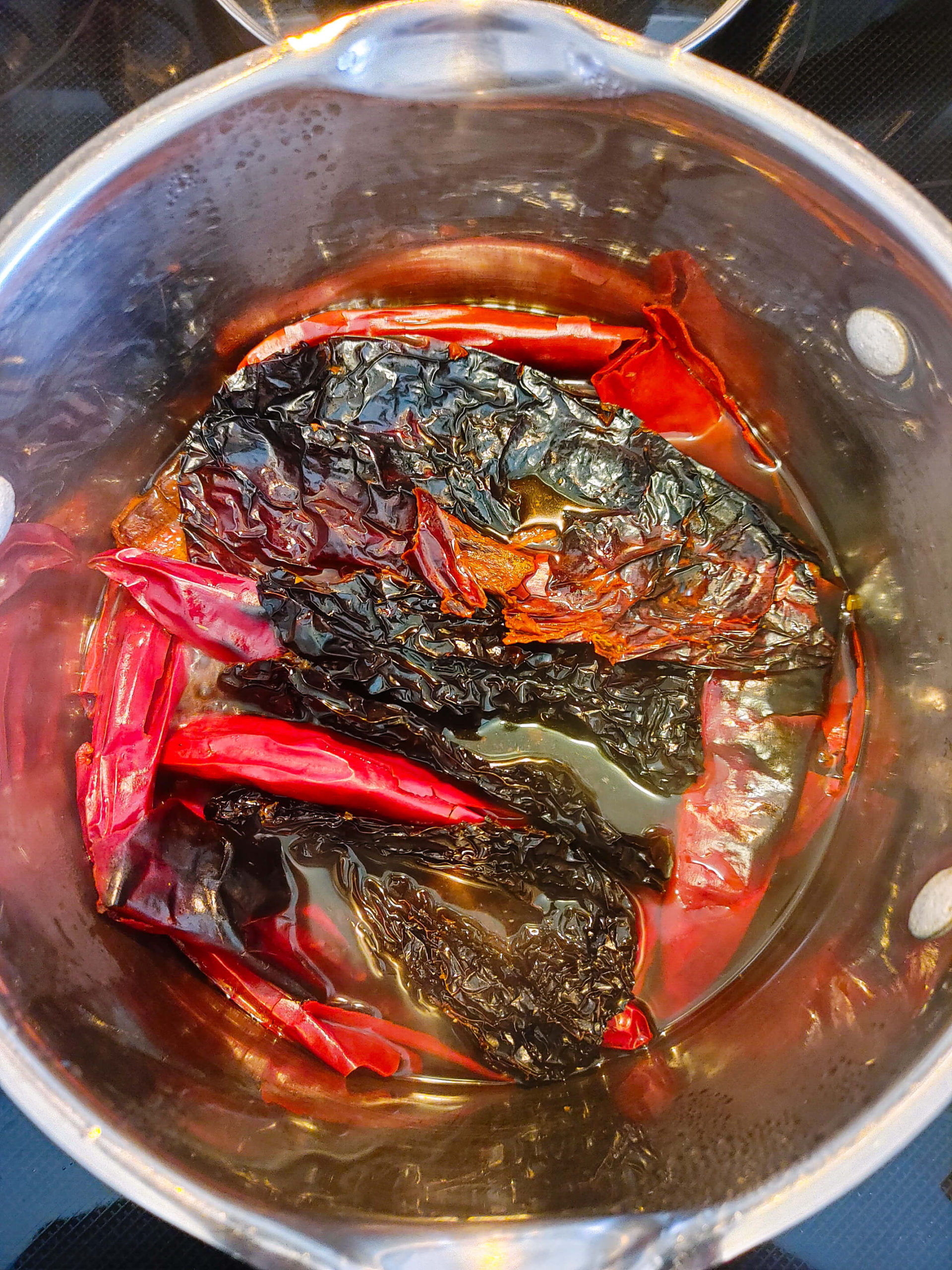SOAK THE PEPPERS IN BOILING WATER OR CHICKEN BROTH
