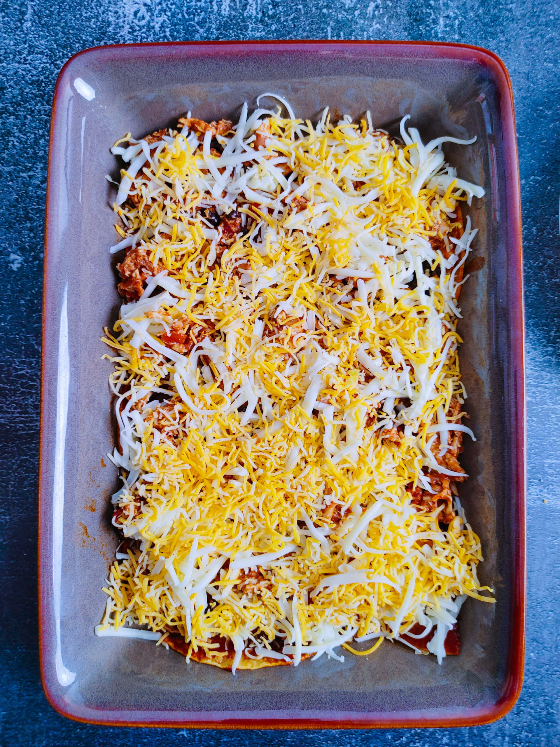 LAYER CHICKEN AND CHEESE AND MORE ENCHILADA SAUCE