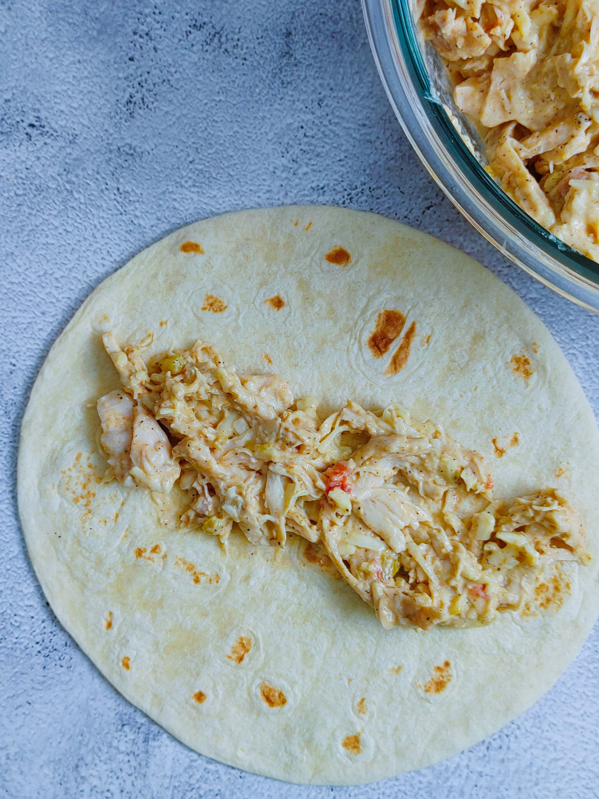 ROLL UP THE CHICKEN INSIDE THE TORTILLA