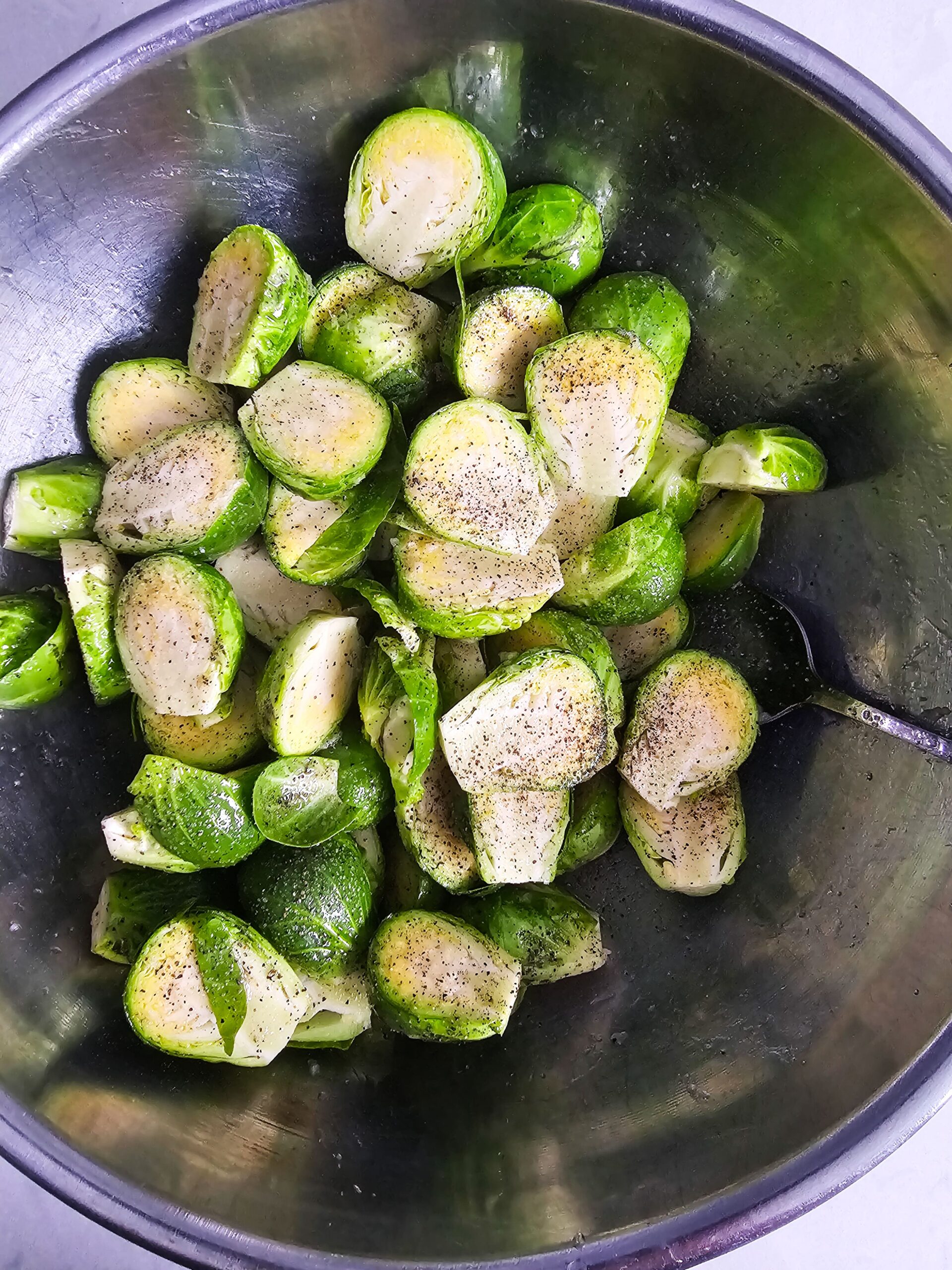 CLEANED THE BRUSSELS SPROUTS AND CUT IN HALF