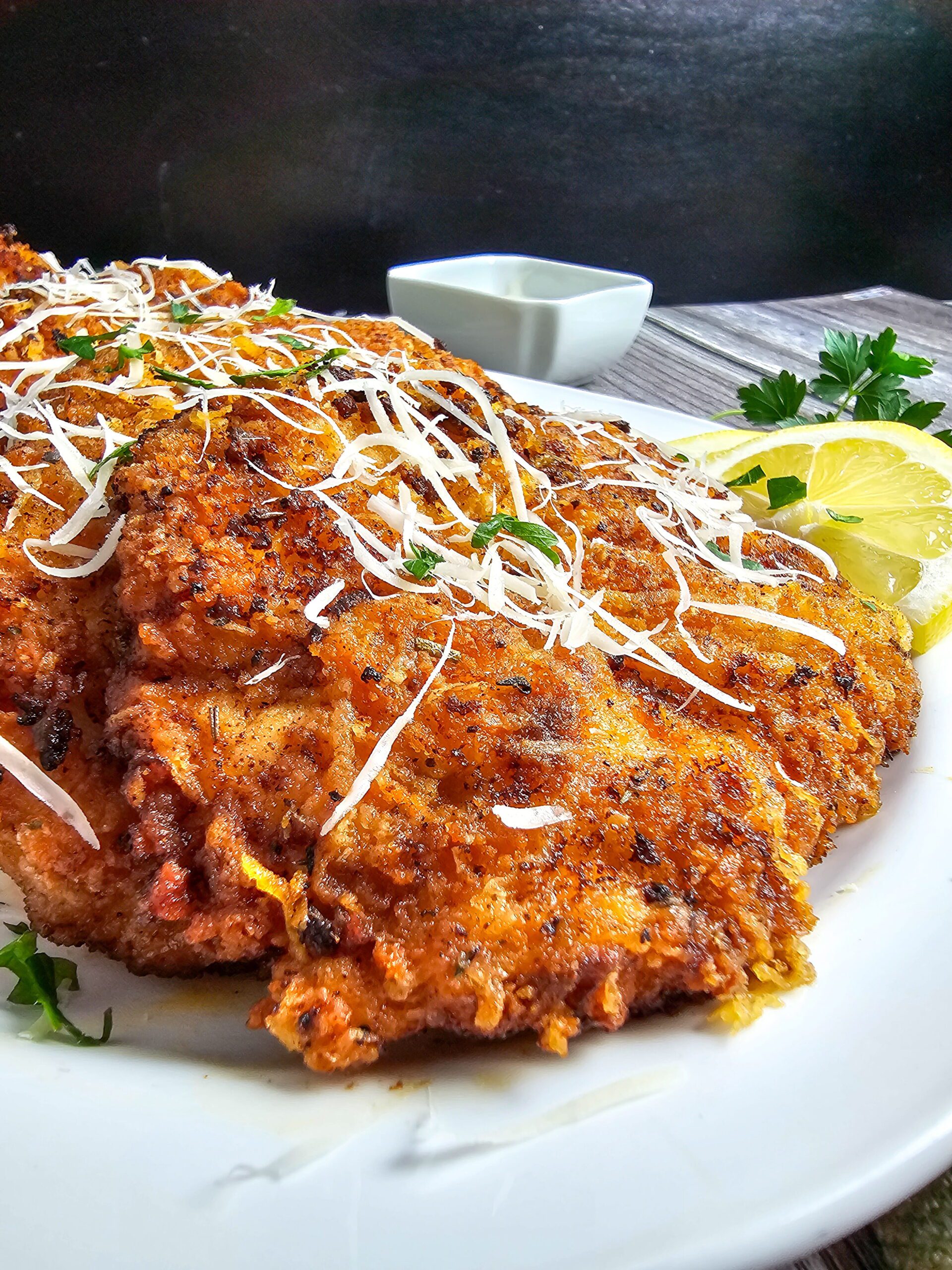 Crispy ranch parmesan chicken cutlets on a plate with golden panko parmesan crust