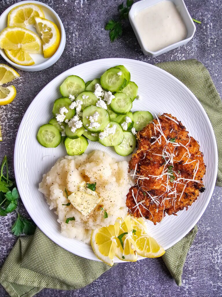 Crispy ranch parmesan chicken cutlets served with creamy garlic mashed potatoes