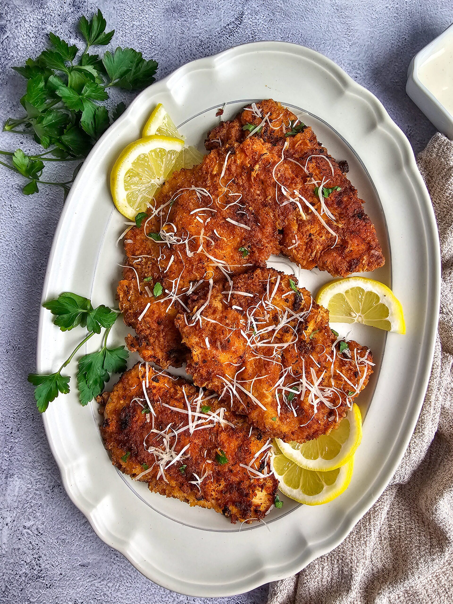 Close-up of crispy parmesan panko crust on pan-fried ranch chicken cutlet