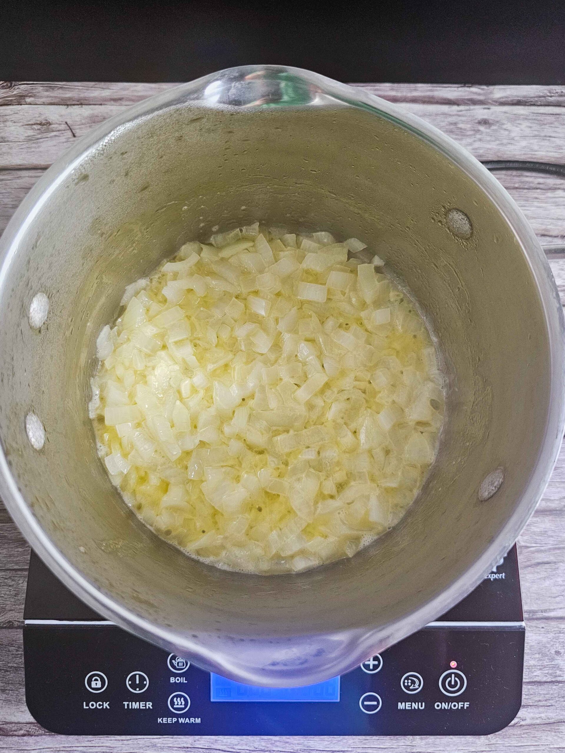 MELT BUTTER IN MEDUIM SAUCE PAN AND ADD THE ONIONS-- SAUTE UNTIL SOFTENED