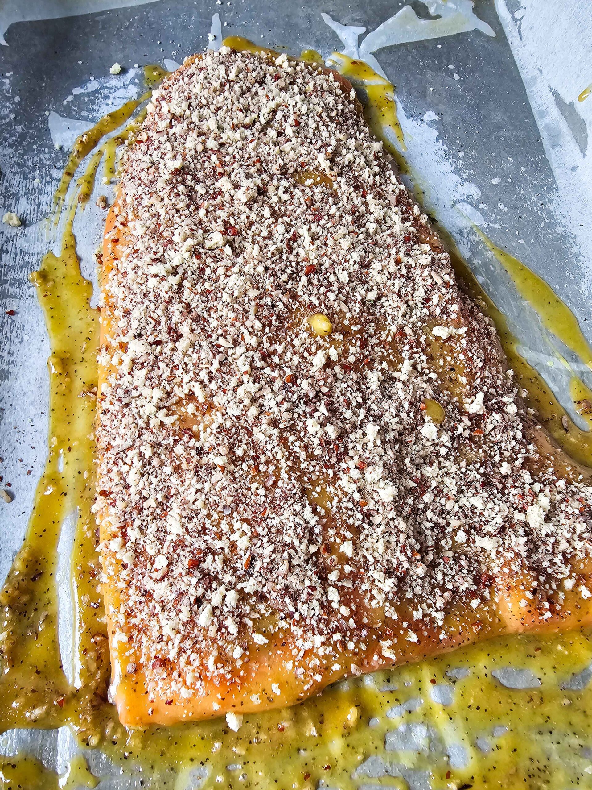 TOP THE SALMON WITH THE WET AND DRY INGREDIENTS