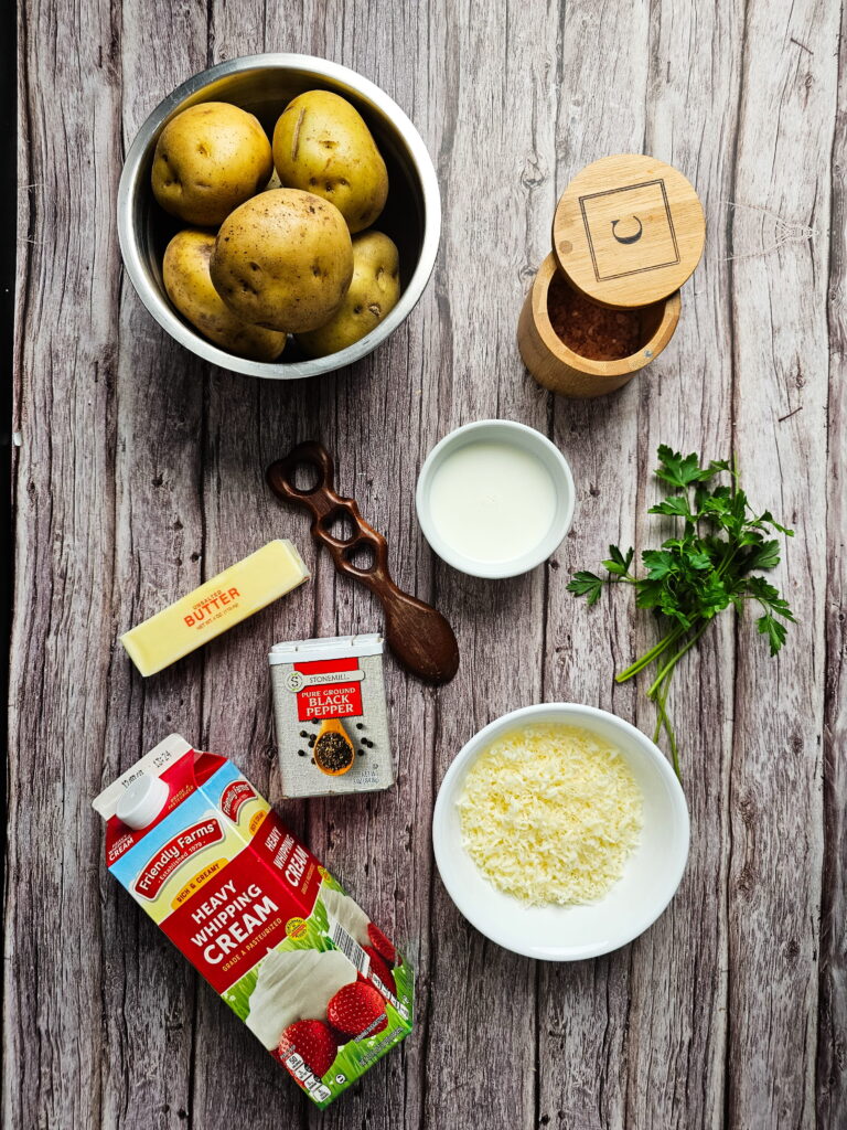 Ingredients for Chantilly mashed potatoes including Yukon Gold potatoes butter heavy cream and Asiago cheese