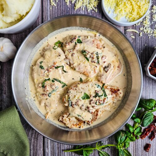 CHICKEN BREASTS COVERED IN THE MARRY ME CHICKEN SAUCE GARNISHED WITH BASIL AND SUN DRIED TOMATO