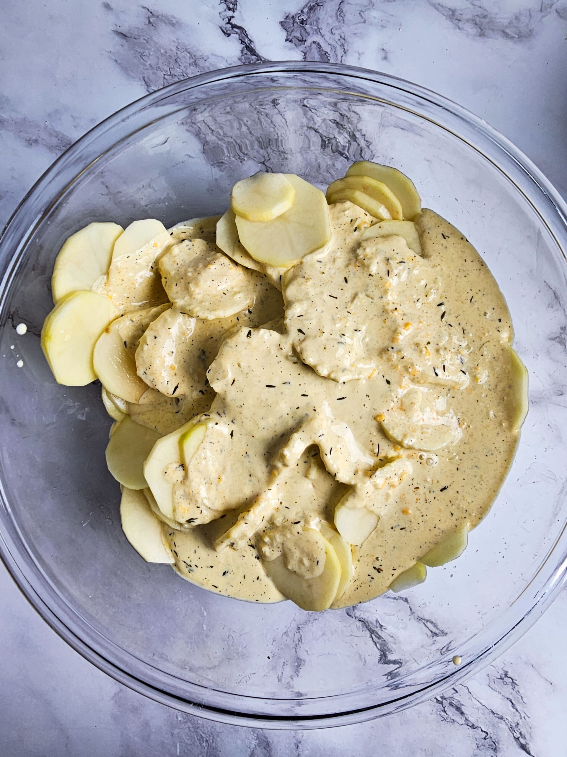 TOSS THE POTATO SLICES IN THE CHEESE SAICE