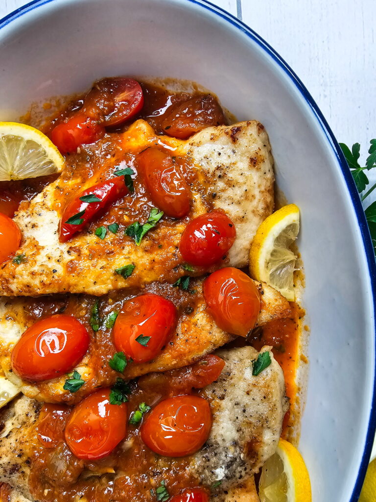 Italian chicken cutlets with tomato sauce ready to serve — easy weeknight dinner in one pan
