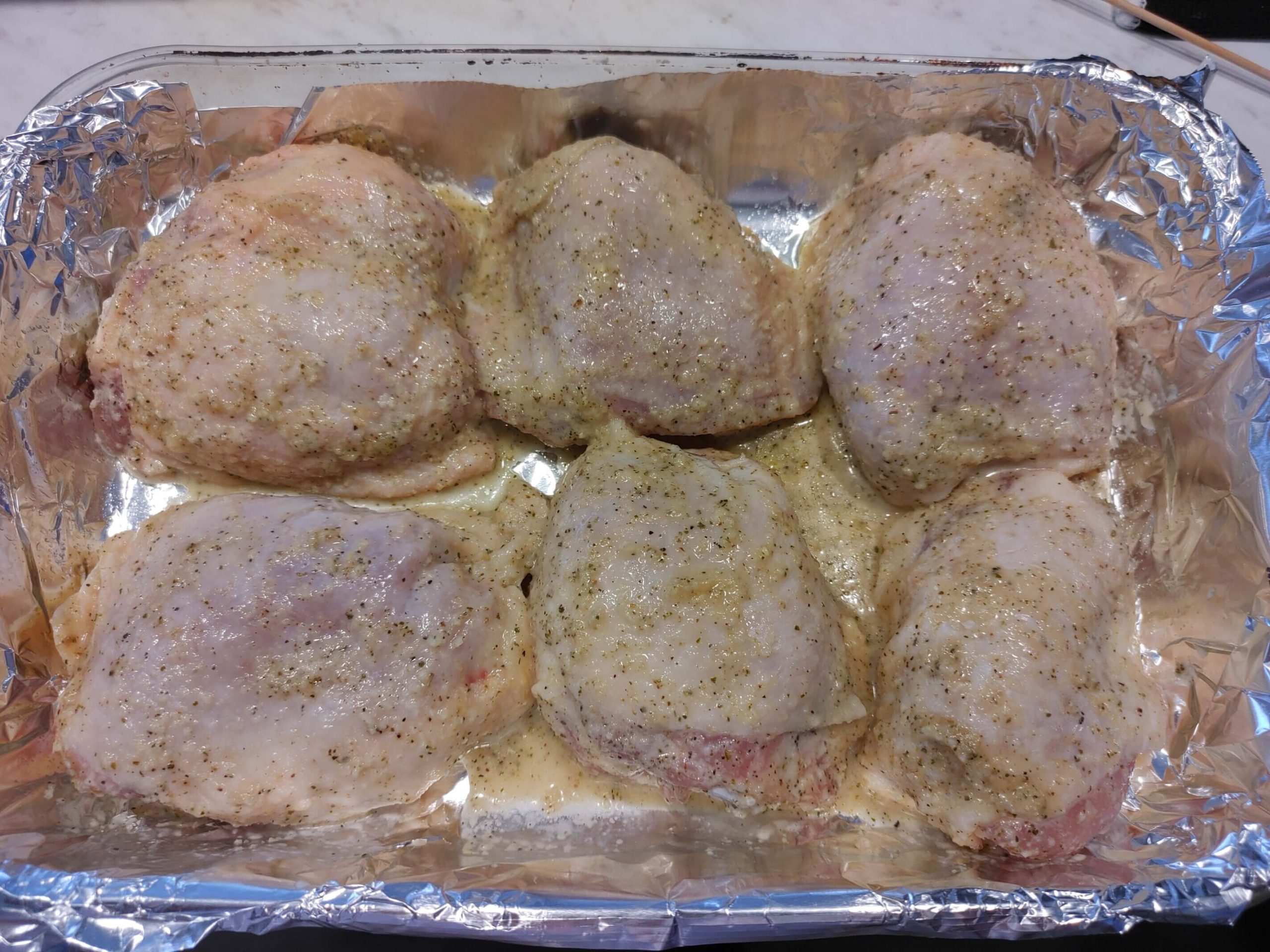 CHICKEN IN A FOIL LINED BAKING DISH