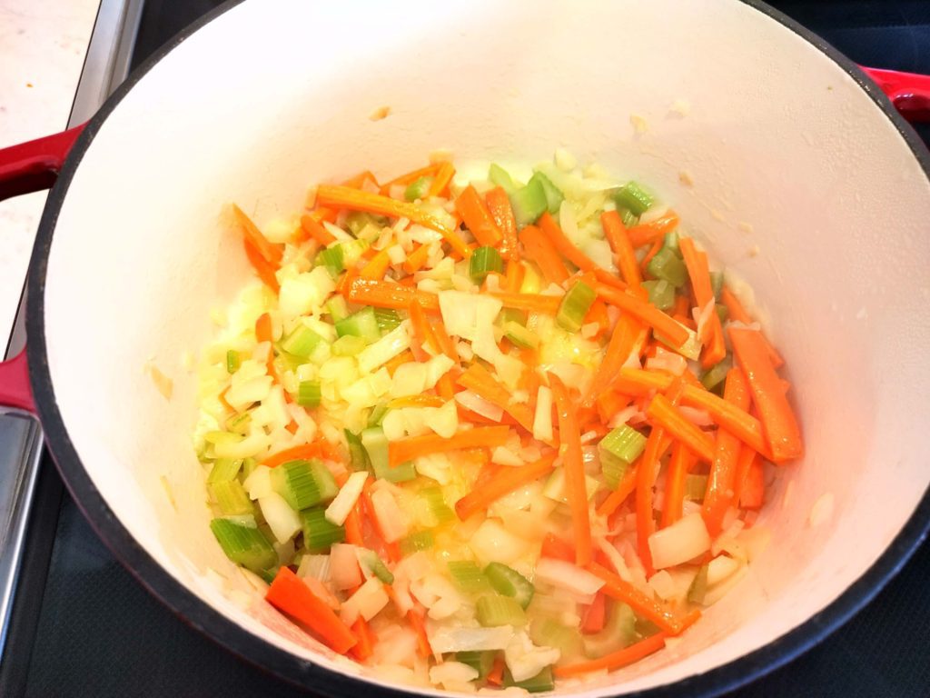 MIX VEGETABLES AND BUTTER IN DUTCH OVEN