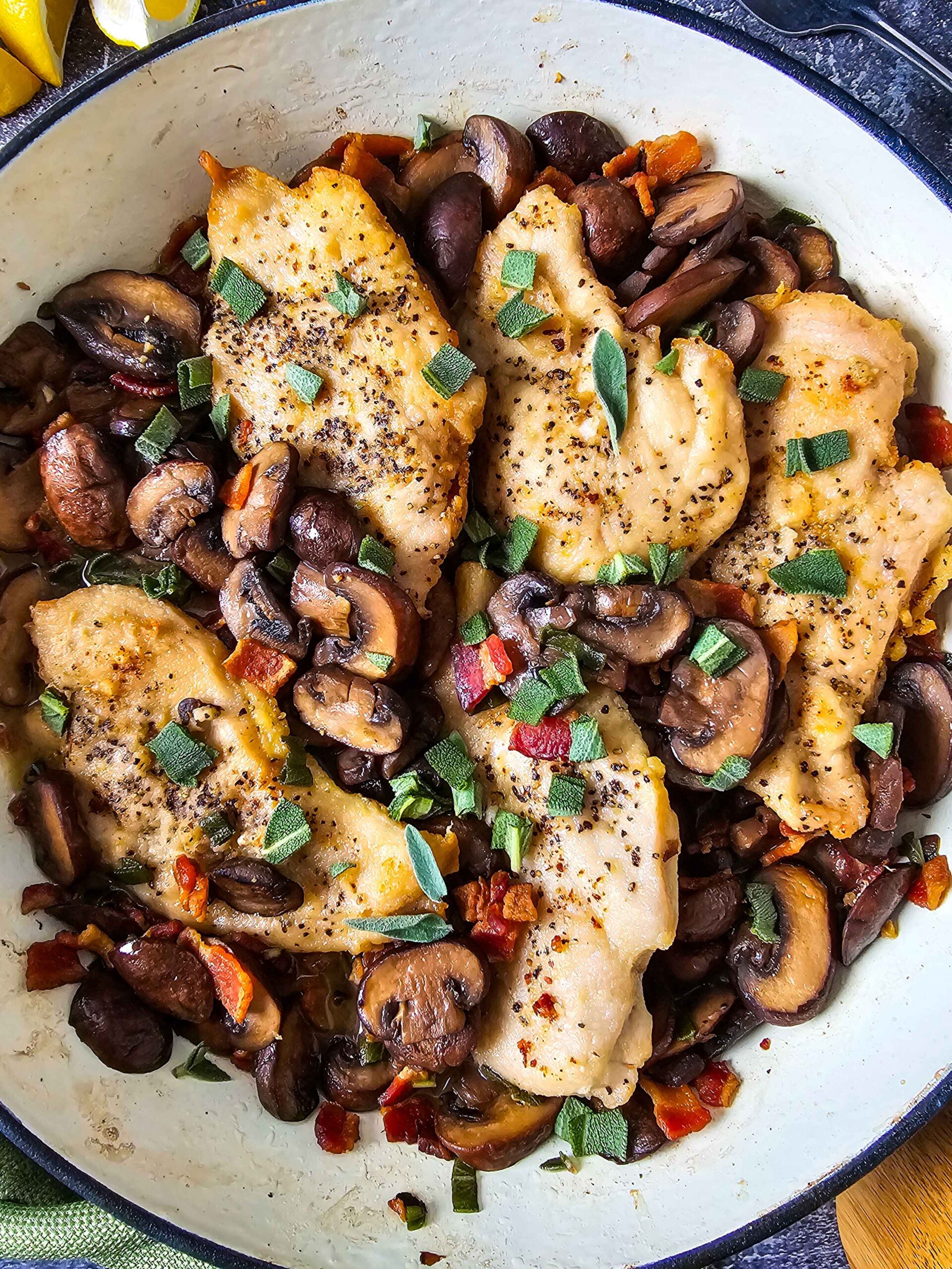 ADD THE CHICKEN BACK TO THE SKILLET AND GARNISH WITH FRESH SAGE LEAVES