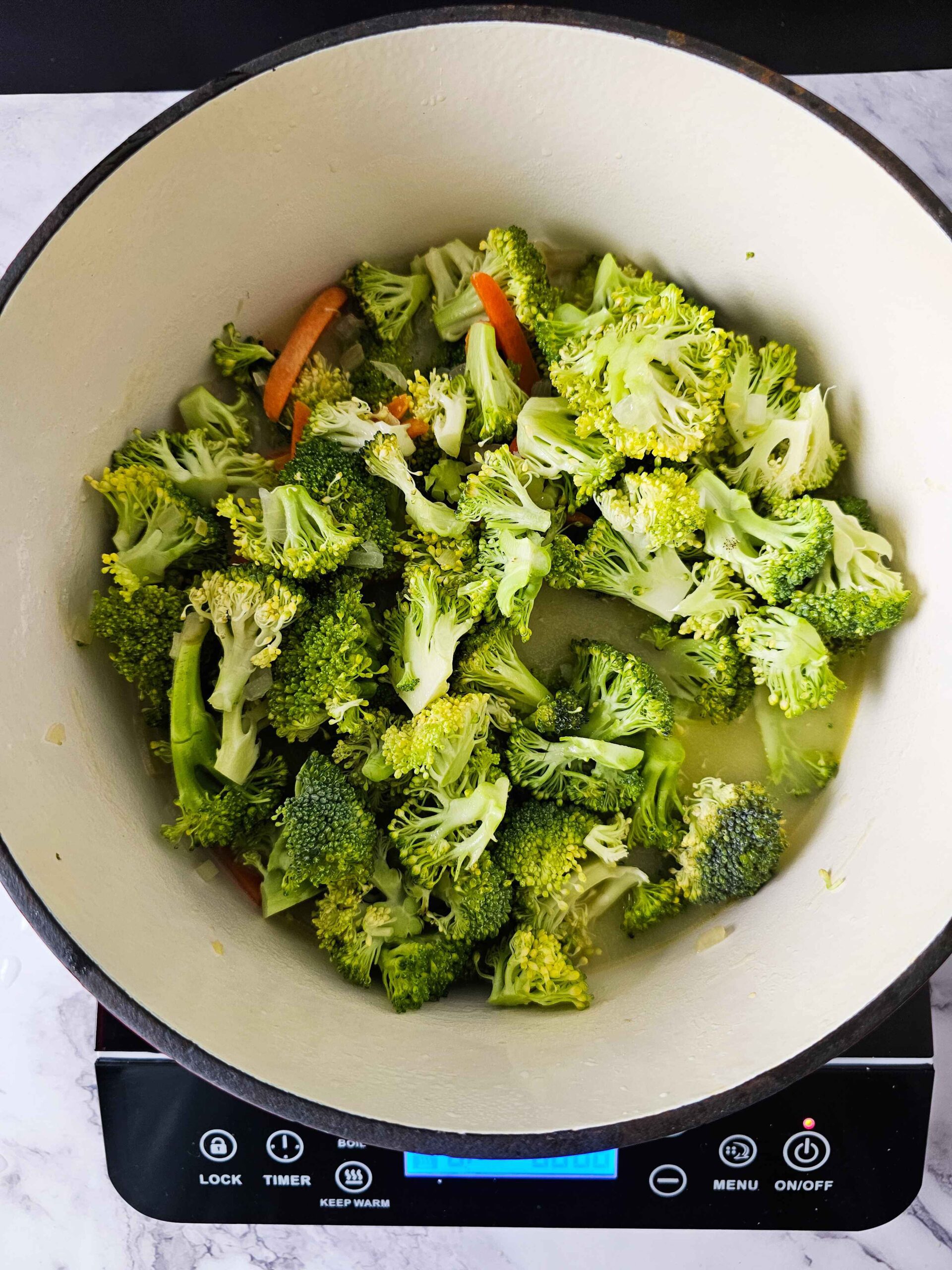 ADD THE BROCCOLI AND SIMMER FOR 15 MINUTES UNTIL TENDER