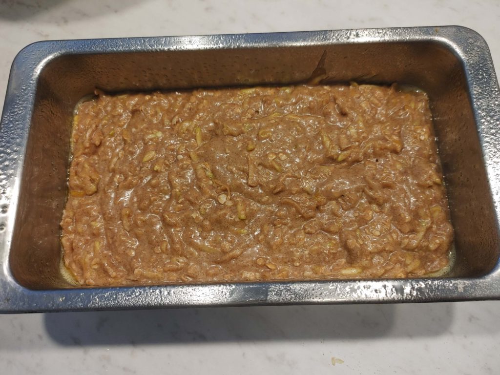 POURED BATTER INTO THE LOAF PAN