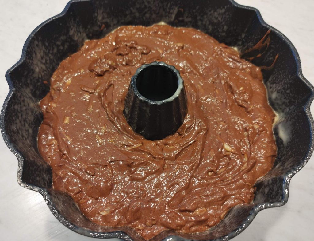 POURING CAKE INTO BUNDT PAN