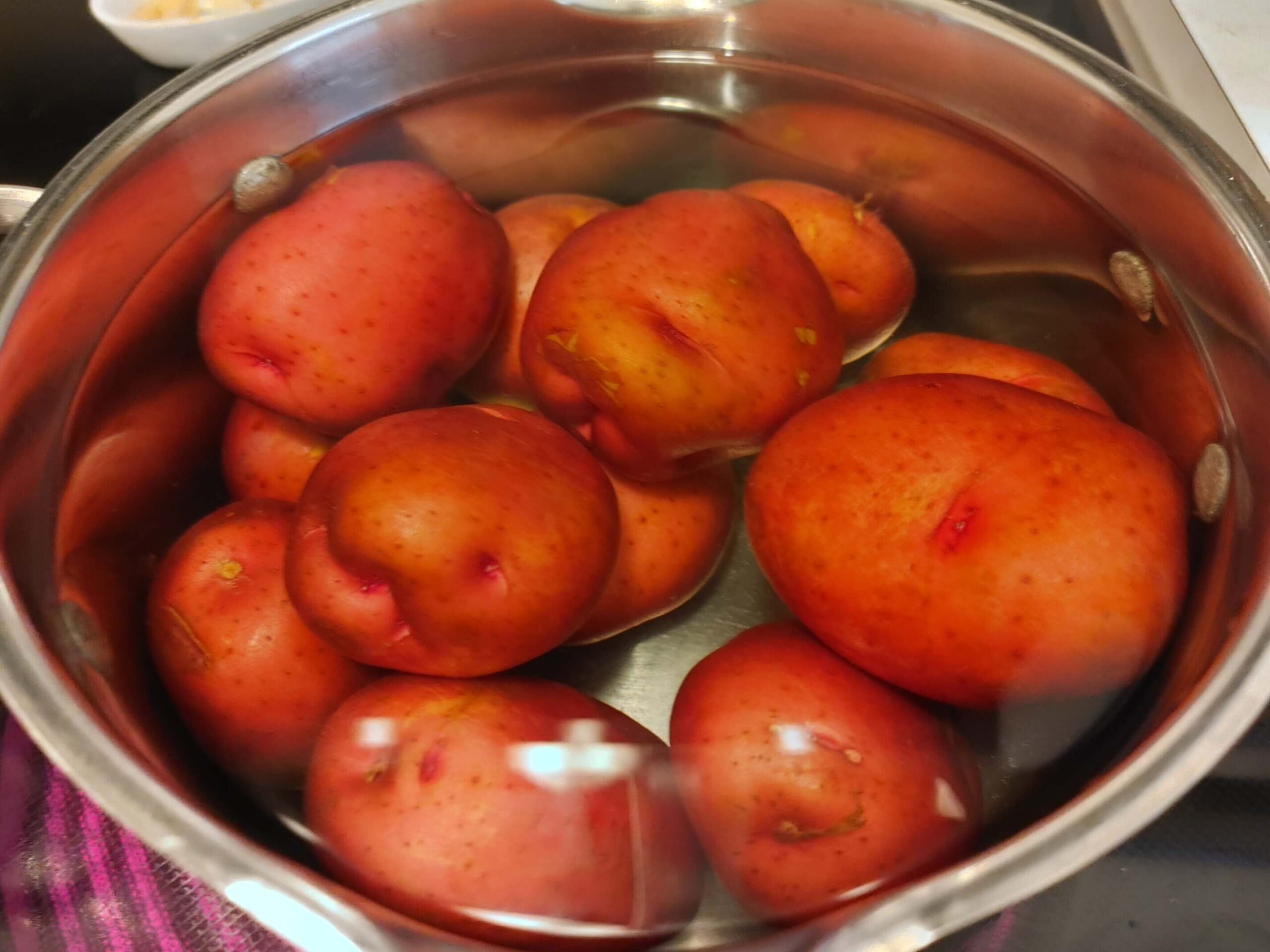 PLACING RED POTATOES TO BOIL