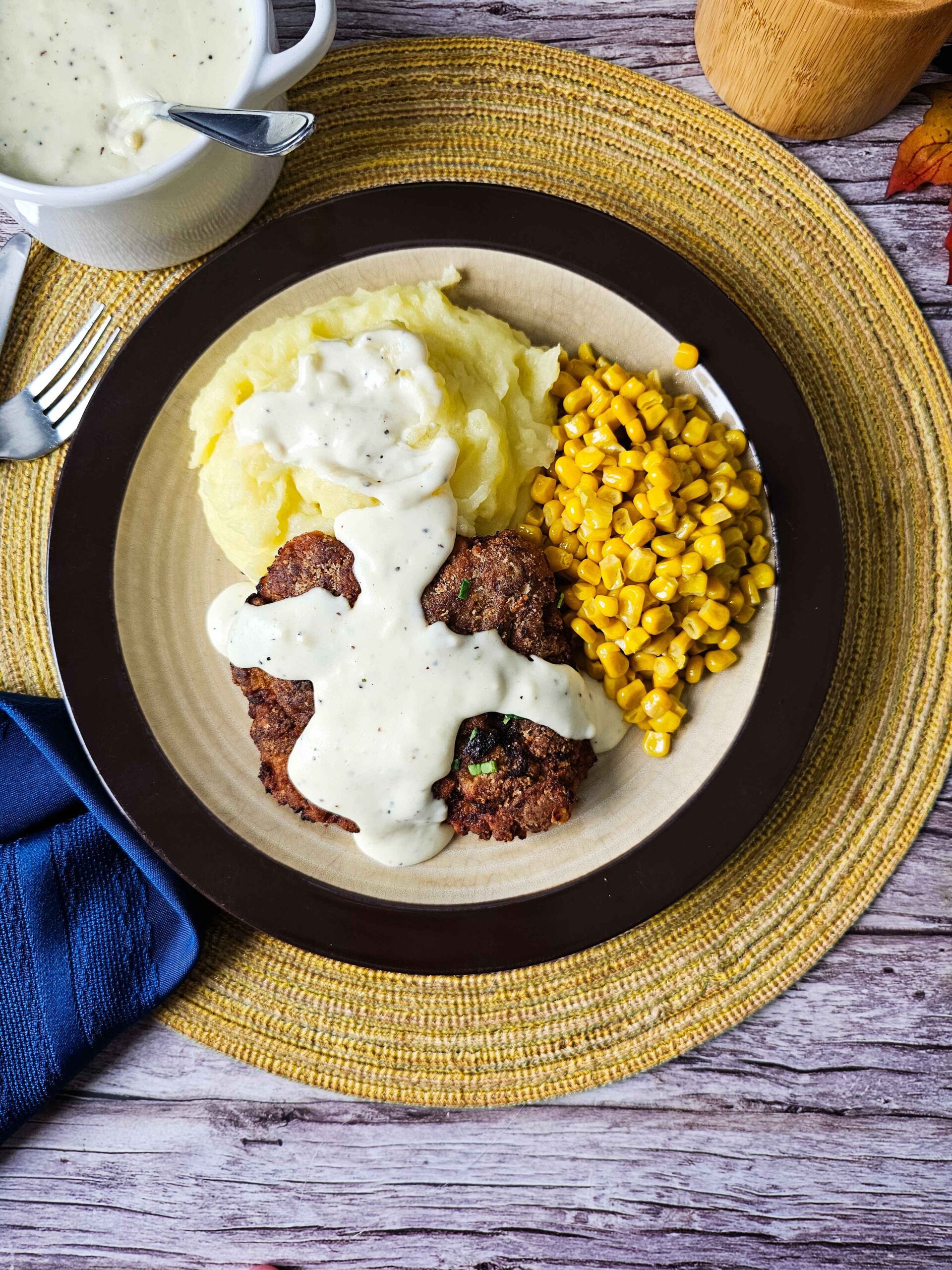 PLATE THE SERVE THE CHICKEN FRIED STEAK WITH WHITE GRAVY