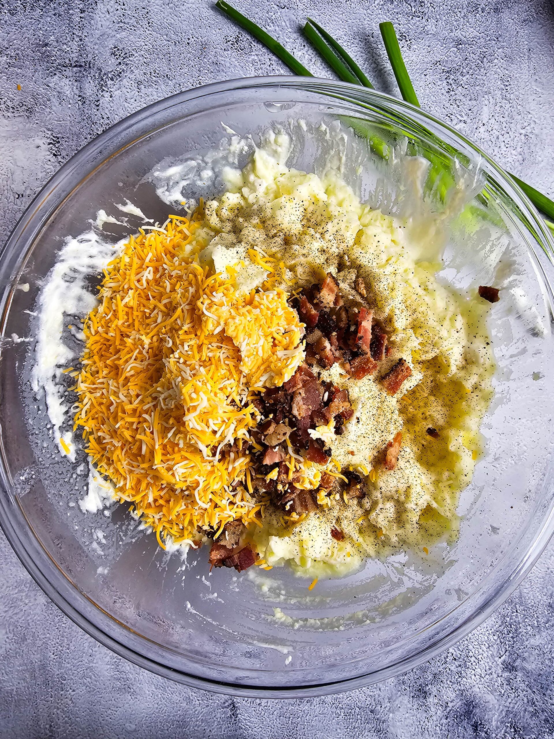 ADD THE BACON AND THE SHREDDED CHEESE