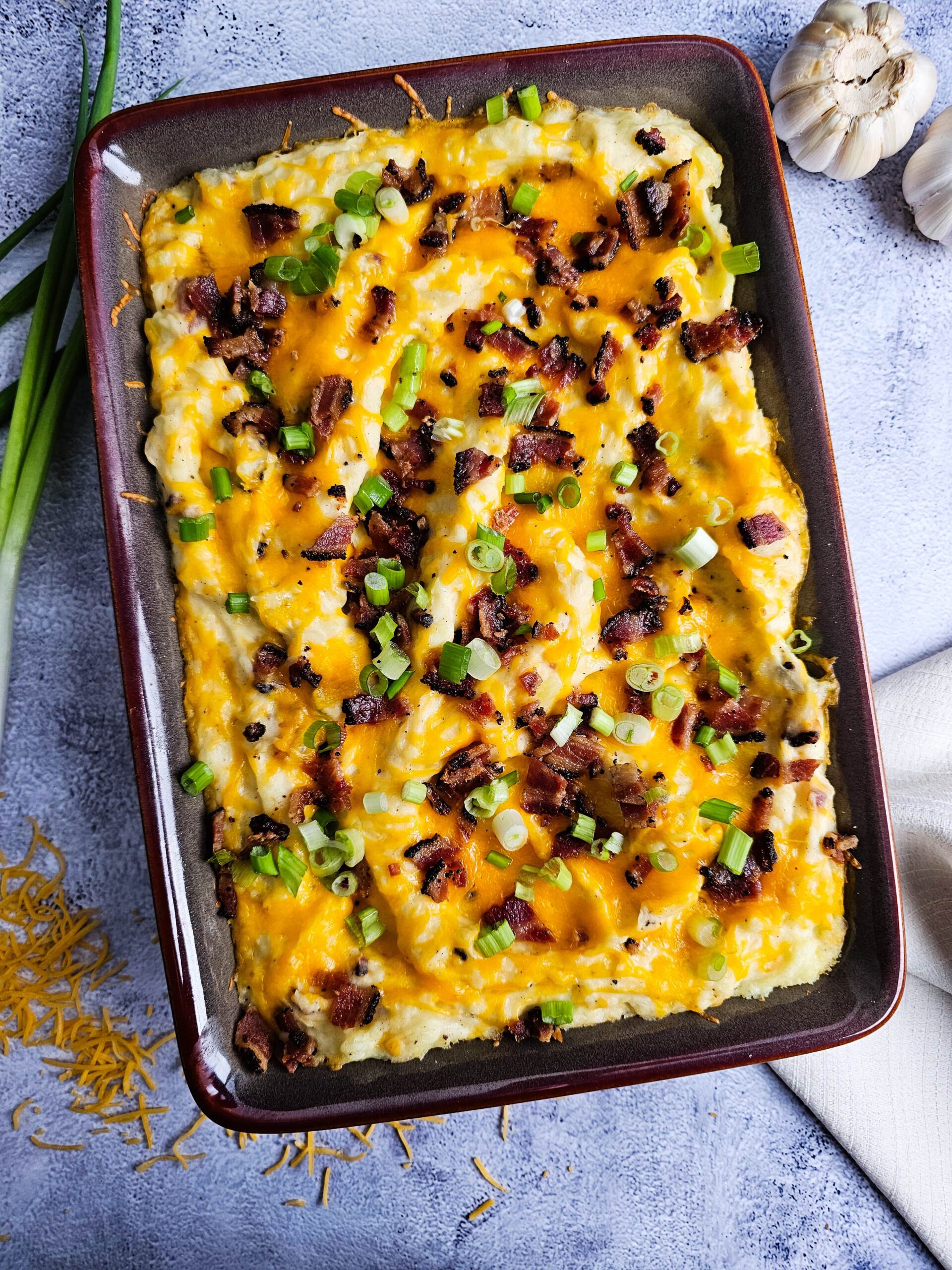 BAKE UNTIL CHEESE IS MELTY AND THE CASSEROLE IS WARM. TOP WITH CHOPPED GREEN ONIONS