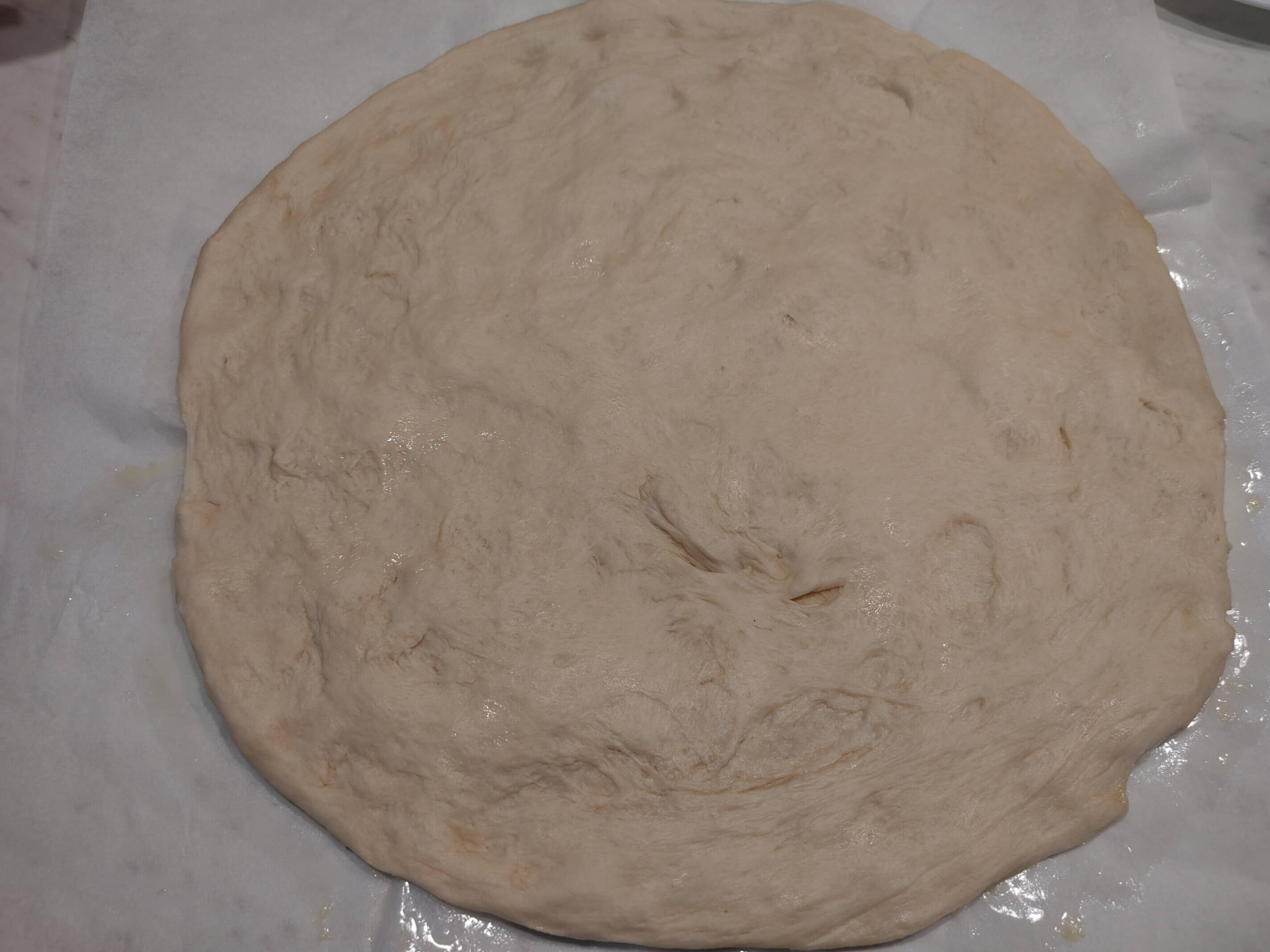 Spreading the dough on parchment paper