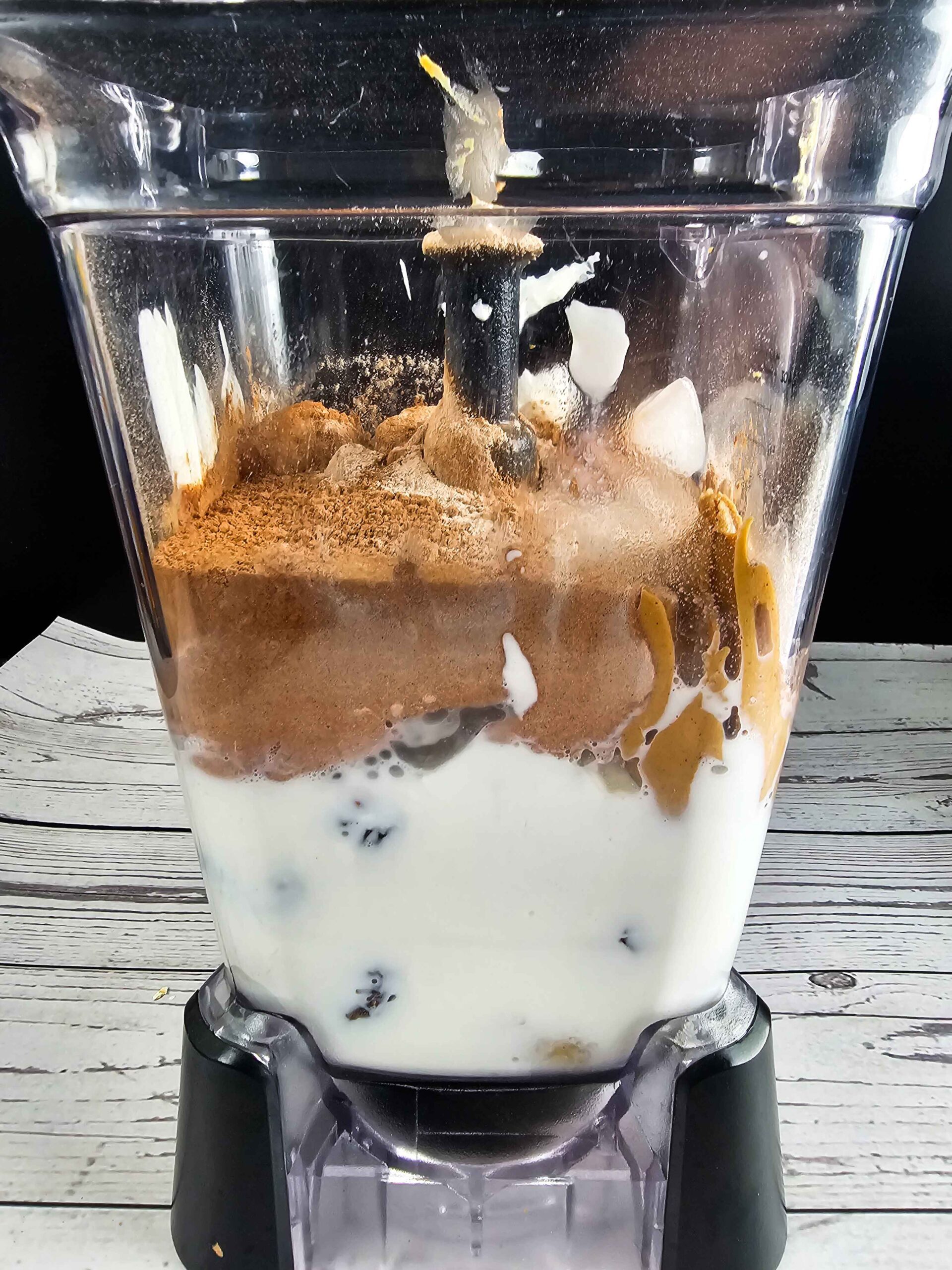 PHOTO OF BLENDER FILLED WITH INGREDIENTS