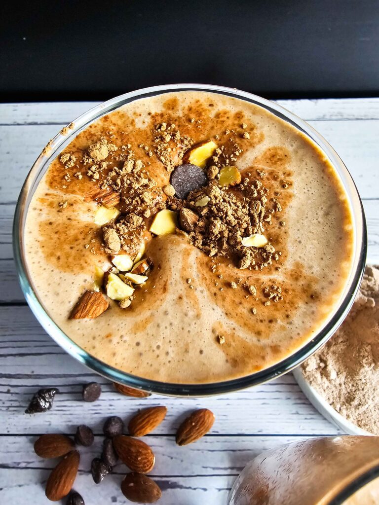 TALL GLASS OF COFFEE SMOOTHIE SPRINKLE OF COCO ON TOP