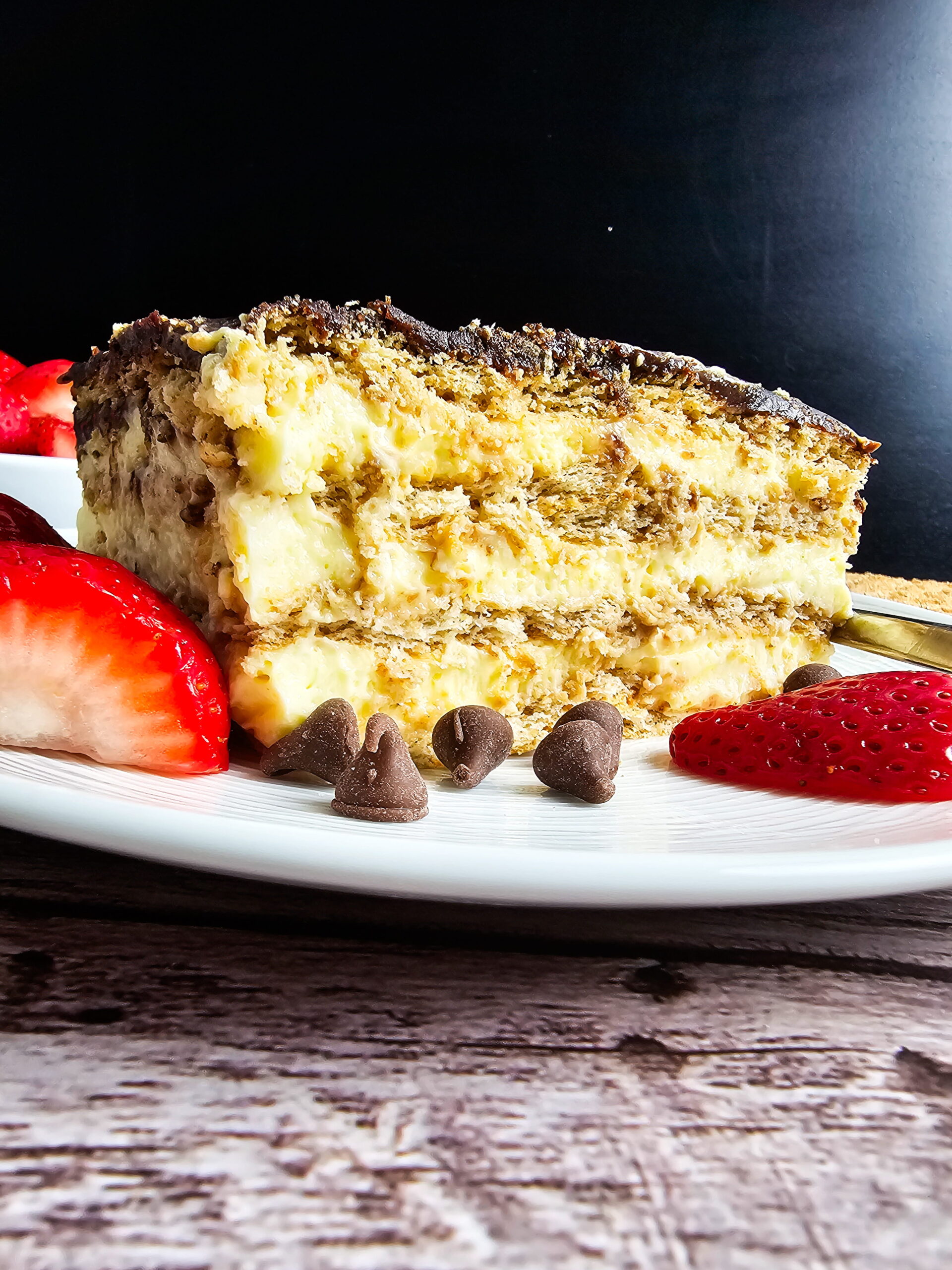 Finished triple-layer chocolate eclair cake in a 14x11 pan ready to refrigerate overnight
