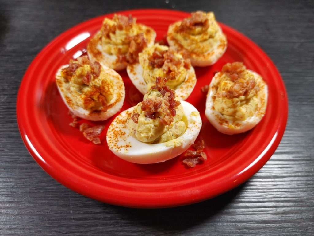 DEVILED EGGS ON RED PLATE