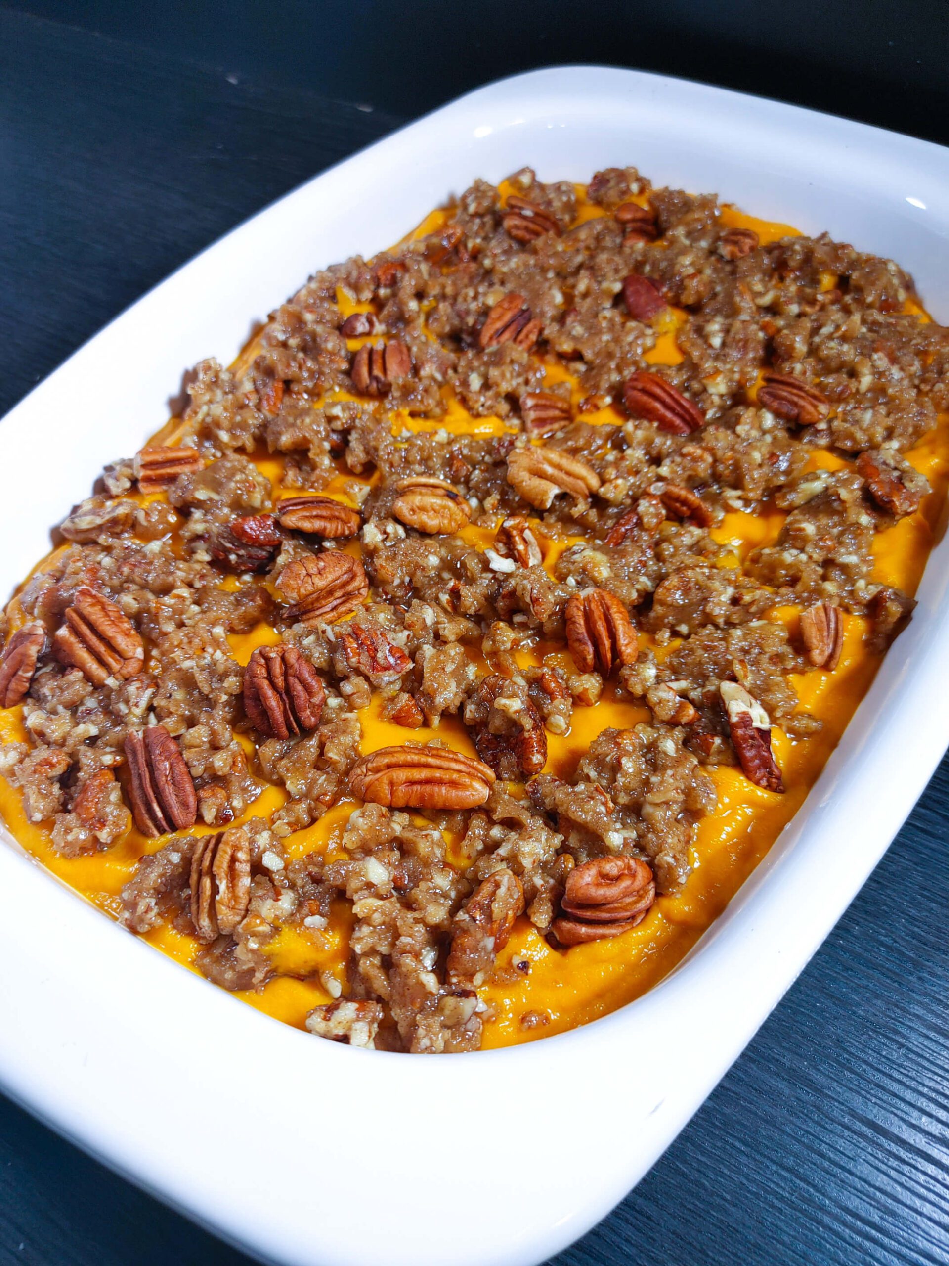 ADD THE PECAN TOPPING TO THE BAKING DISH AND BAKE