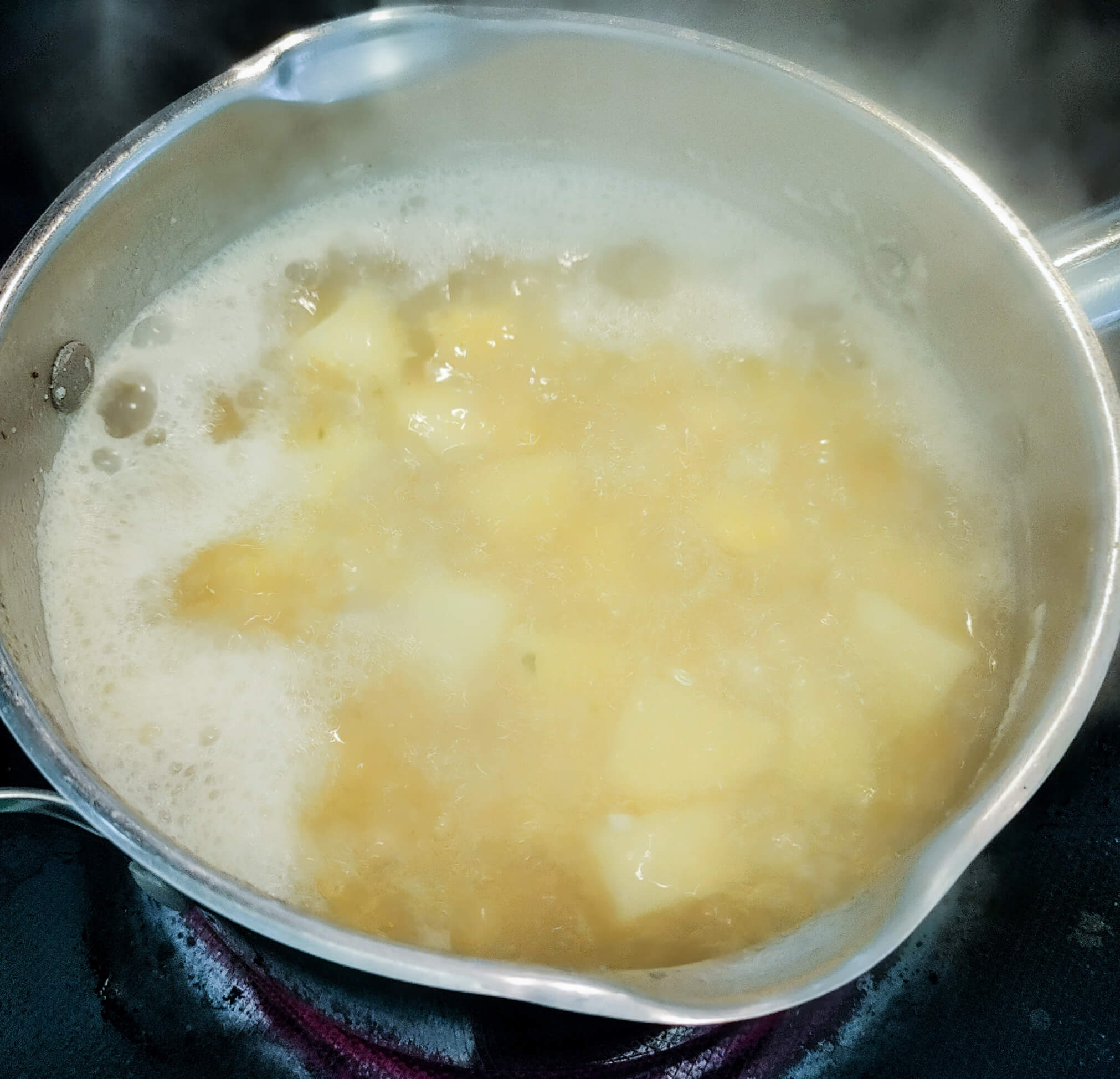 boil the potatoes in the chicken stock until fork tender