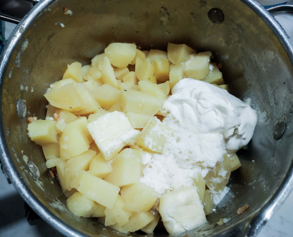 ADDING BUTTER, SOUR CREAM, AND HALF AND HALF