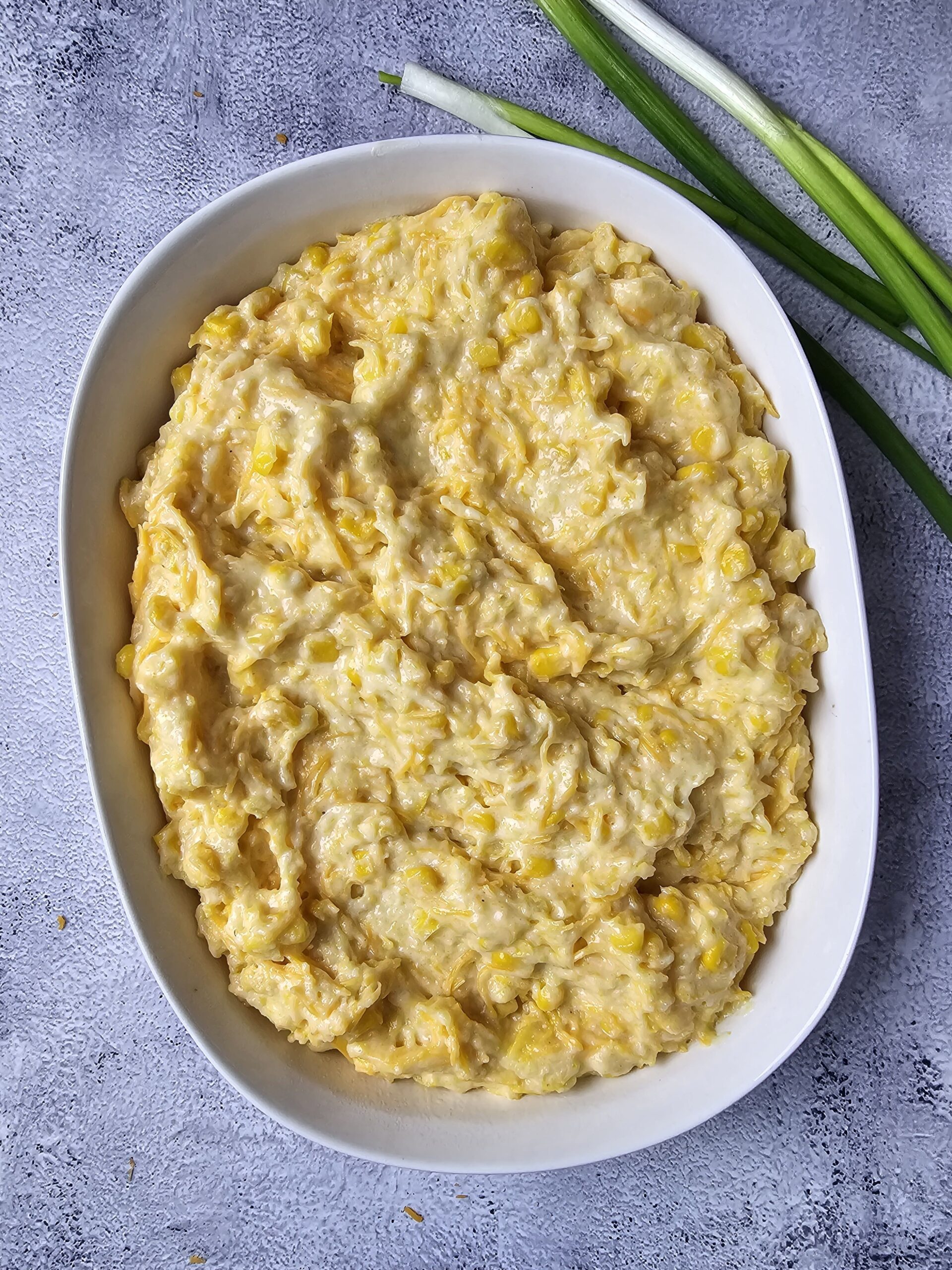POUR THE COMBINED THE INGREDIENTS INTO A OVAL BAKING DISH