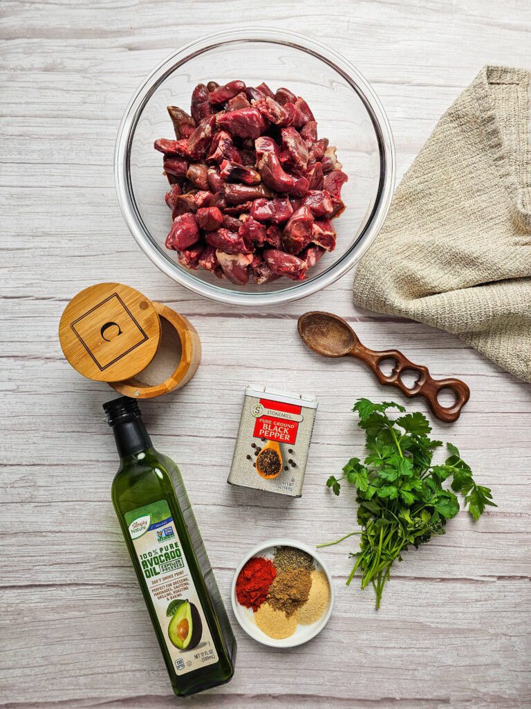 ingredients for sauteed chicken hearts including avocado oil smoked paprika and fresh spices