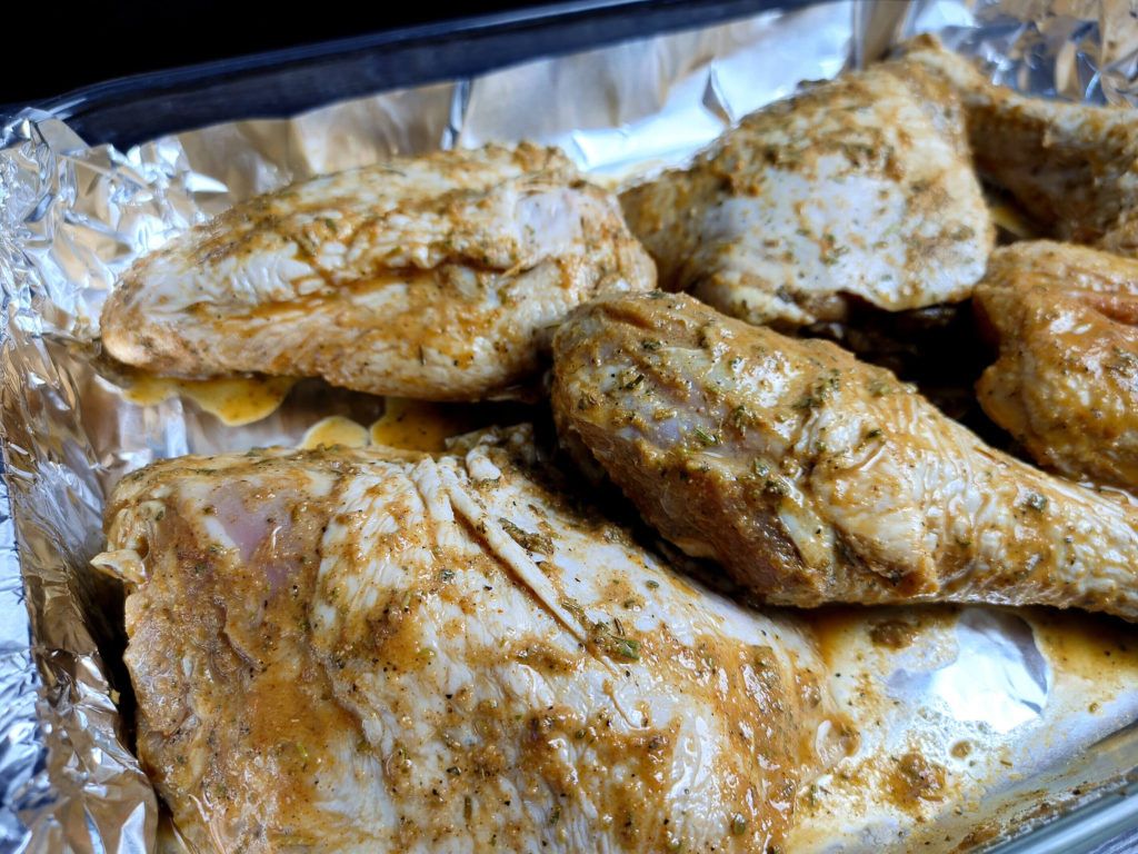 marinaded turkey legs in pan ready to roast