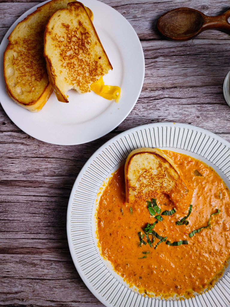 GRILLED CHEESE SANDWICHES SERVED WITH TOMATO SOUP