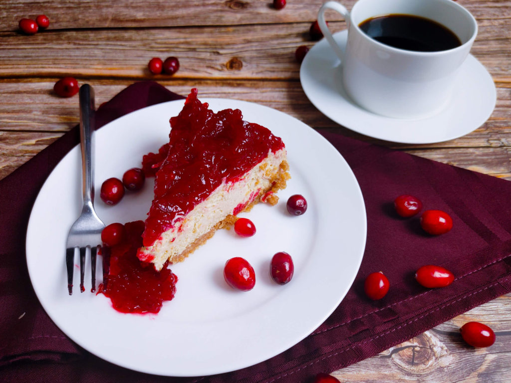 SLICE OF CREAMY HOLIDAY CRANBERRY CHEESECAKE