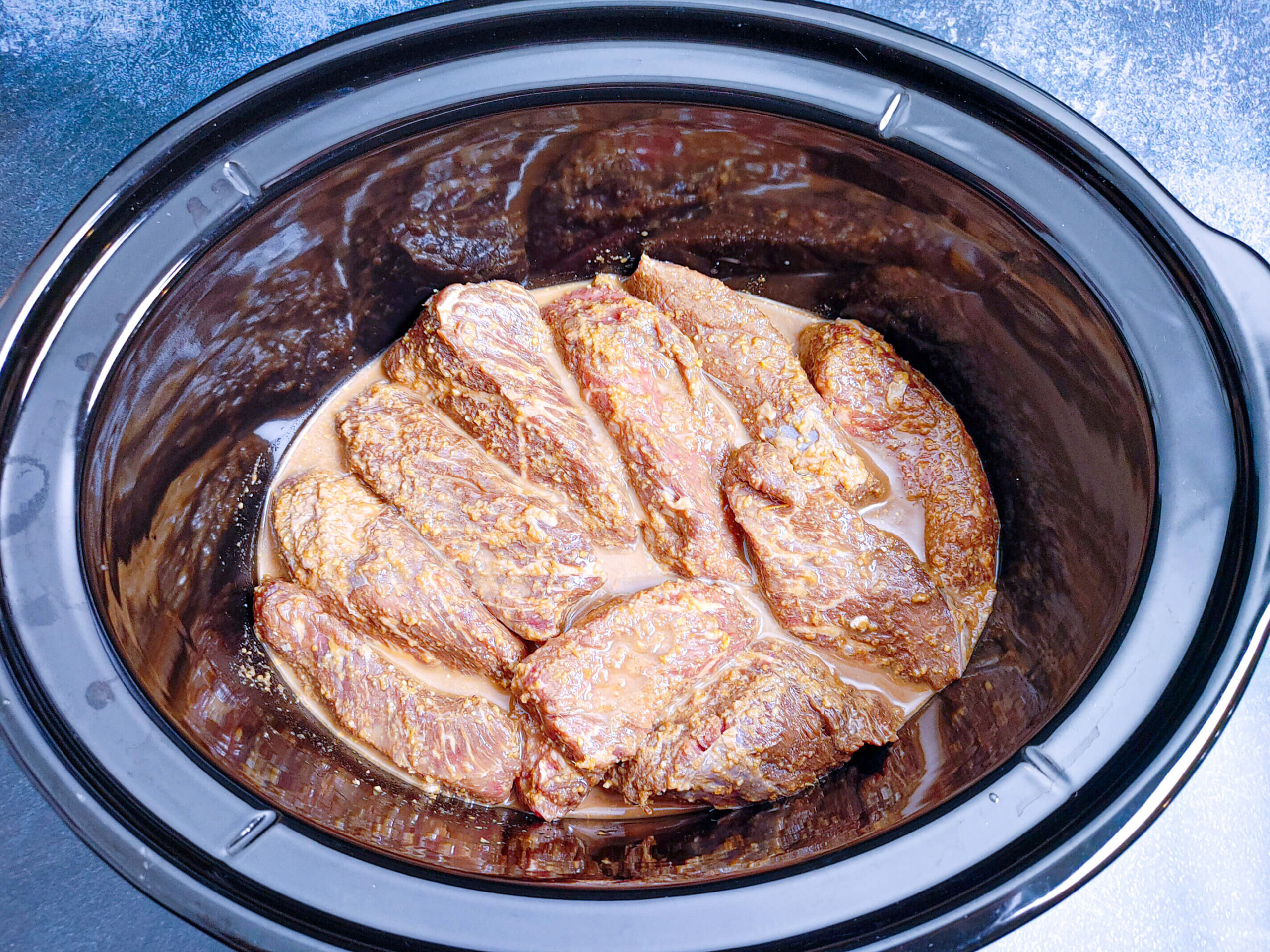 ADDING RIBS TO THE SLOW COOKER