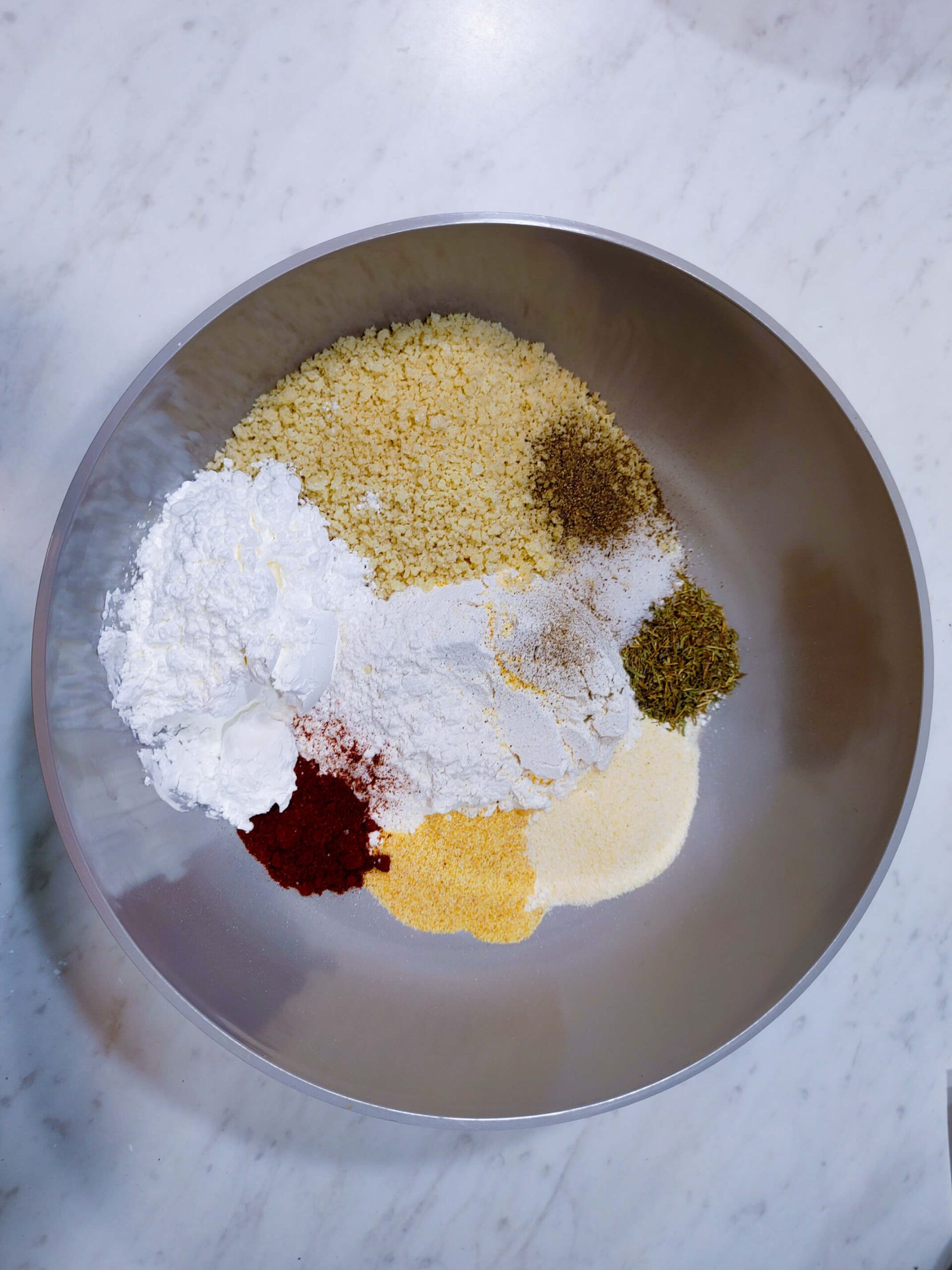 seasoned panko breadcrumb and flour mixture with smoked paprika garlic powder for crispy chicken thighs