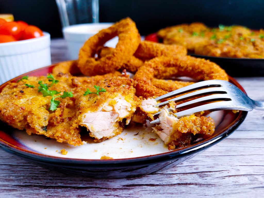 close up of crispy golden panko crust on air fryer breaded chicken thighs