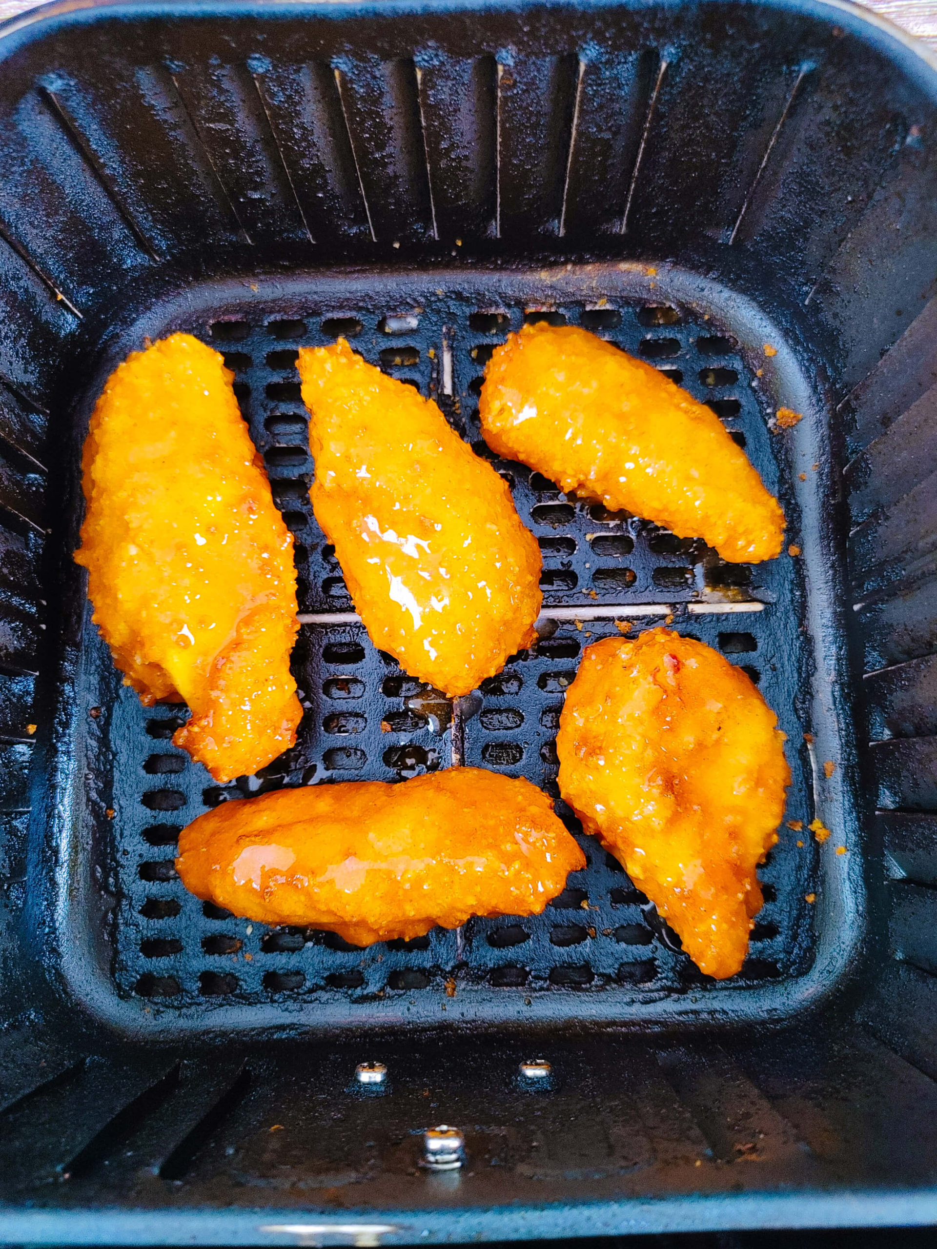 DIP TENDERS IN BUFFALO SAUCE AND CONTINUE TO AIR FRY