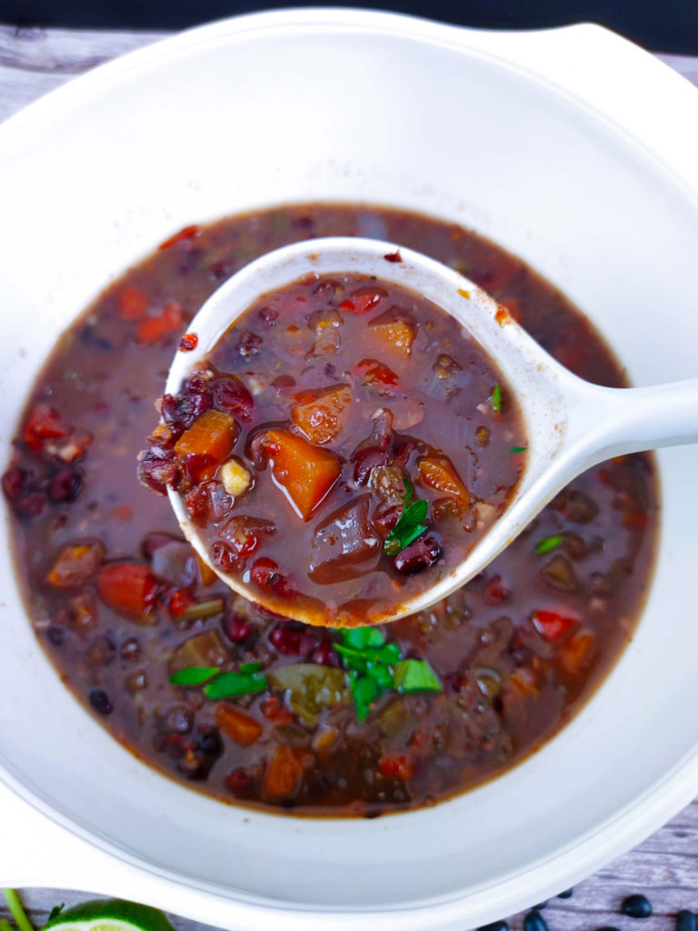 UP CLOSE BLACK BEAN SOUP ON LADLE