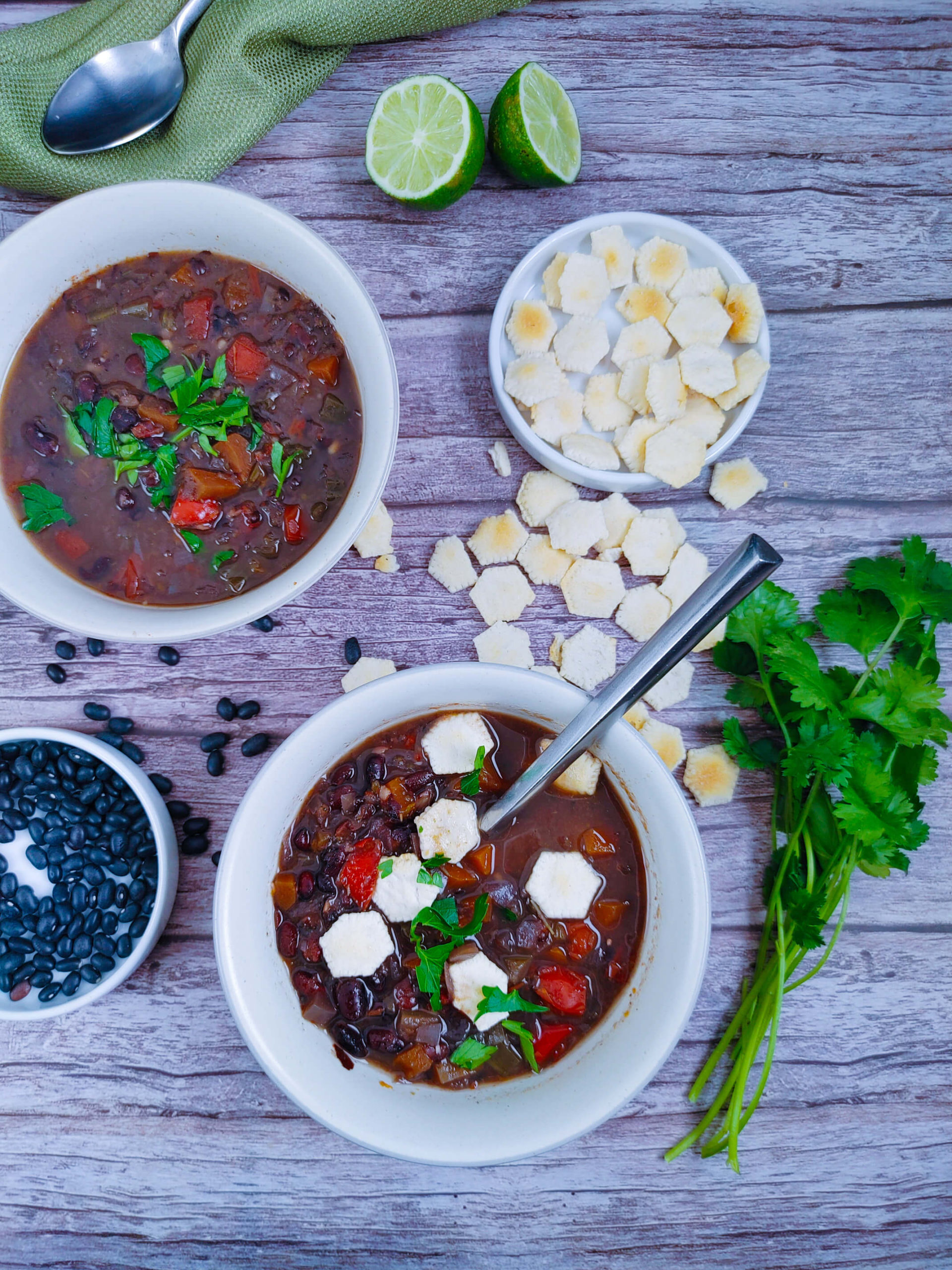 PLATE THE BLACK BEAN SOUP, SQEEZE THE LIME AND CILANTRO