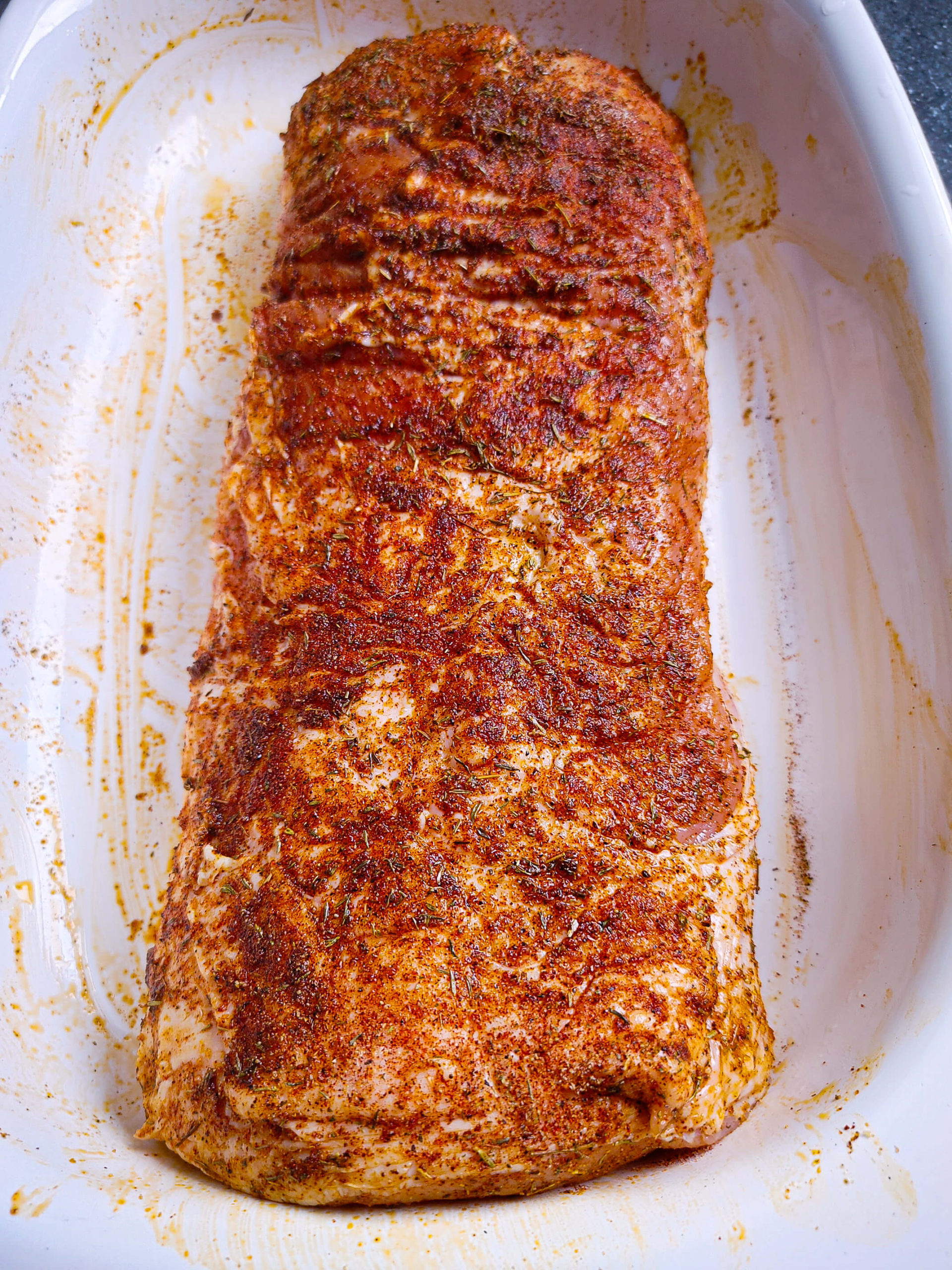 COAT THE PORK LOIN WITH THE SPICE RUB