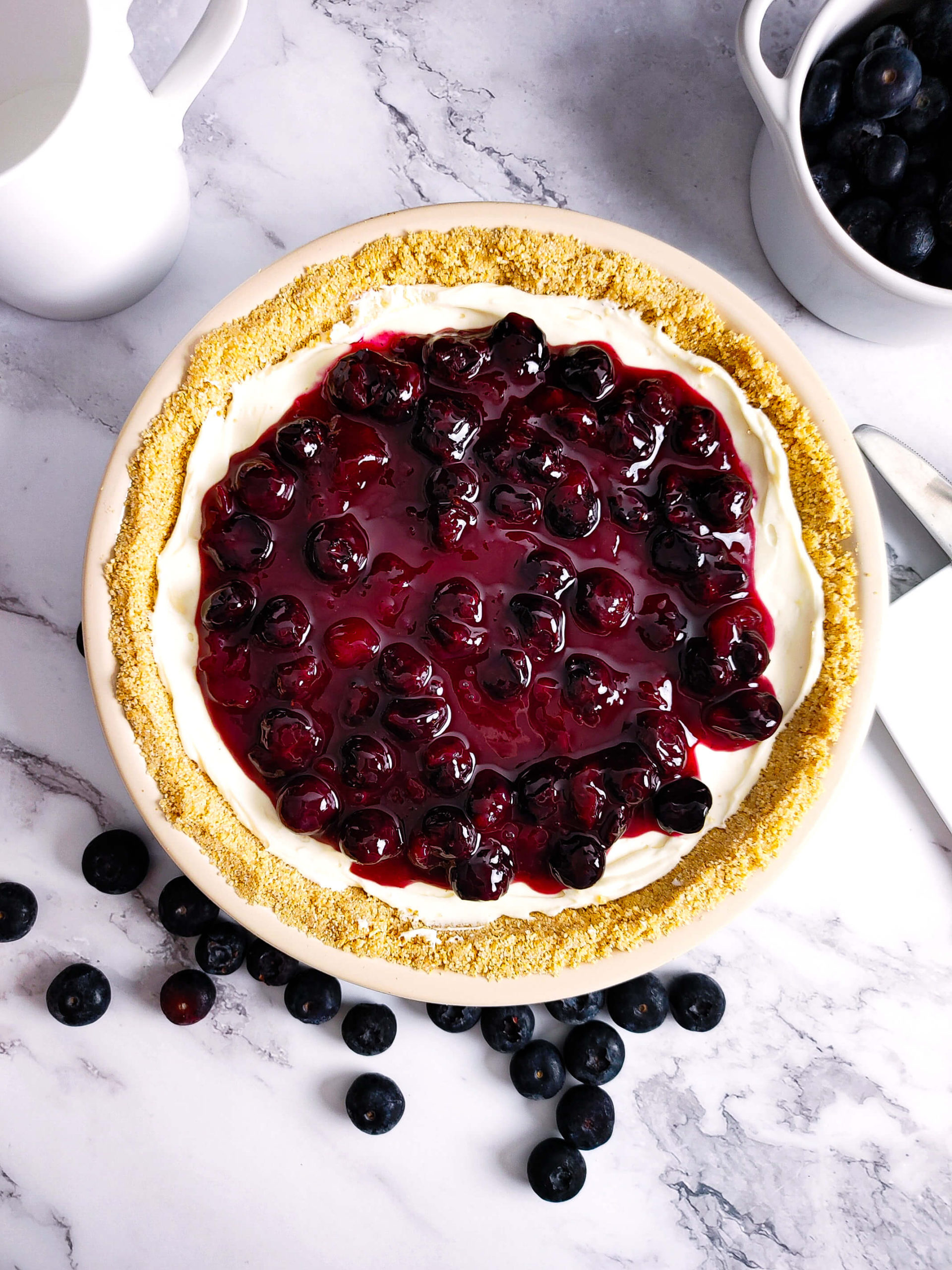 TOP THE CHEESECAKE WITH THE BLUEBERRY TOPPING