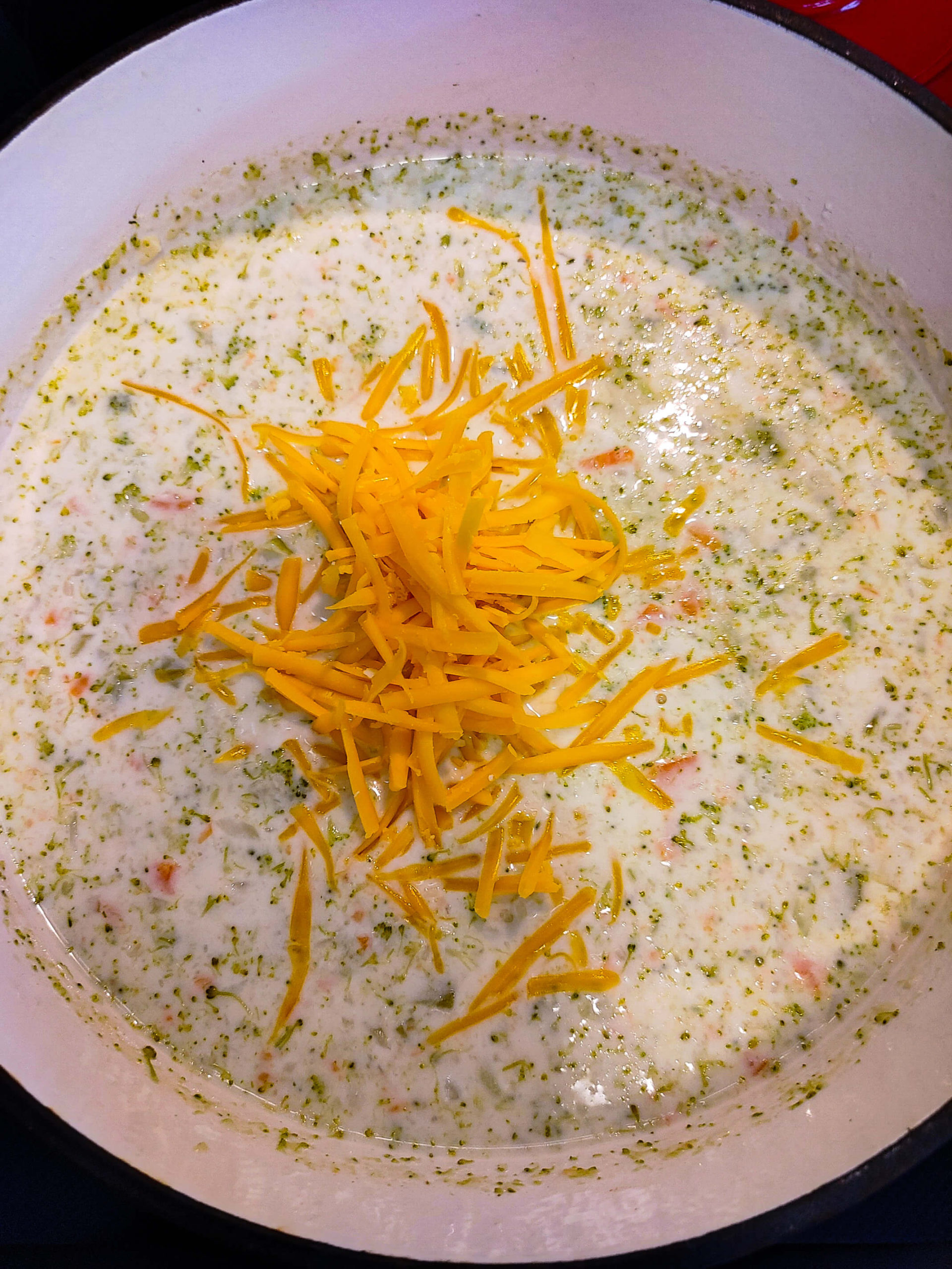 aDD HEAVY WHIPPING CREAM AND EXTRA SHARP CHEDDAR CHEESE TO THE POT