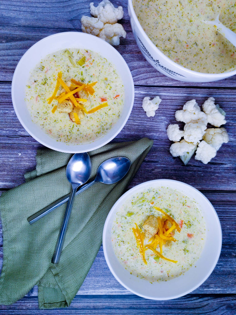 PLATED BROCCOLI AND CAULIFLOWER SOUP IN BOWLS