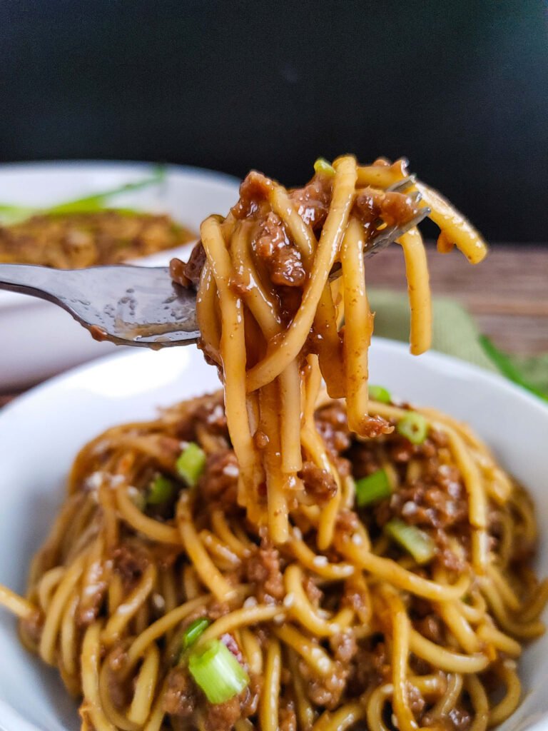 MONGOLIAN GROUND BEEF AND NOODLE ON A FORK