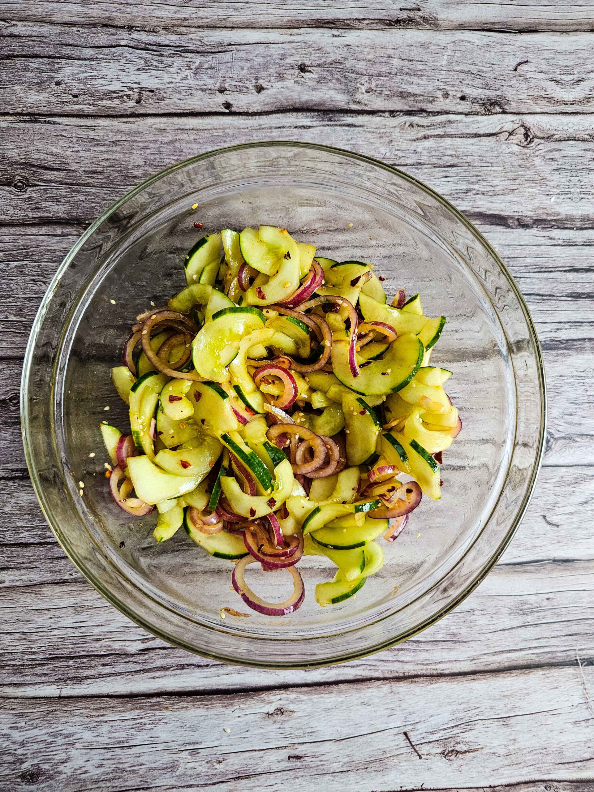 COMBINE THE CUCUMBER AND THE DRESSING